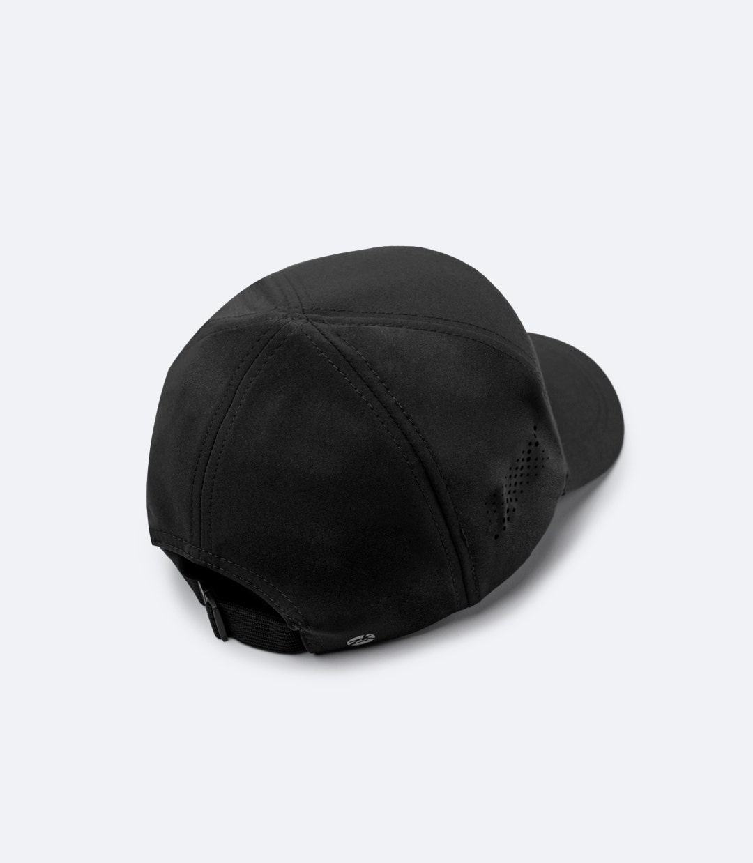 Back of Zhik Team Sports Cap in black, showing adjustable strap with unlockable clip and breathable laser-cut ventilation