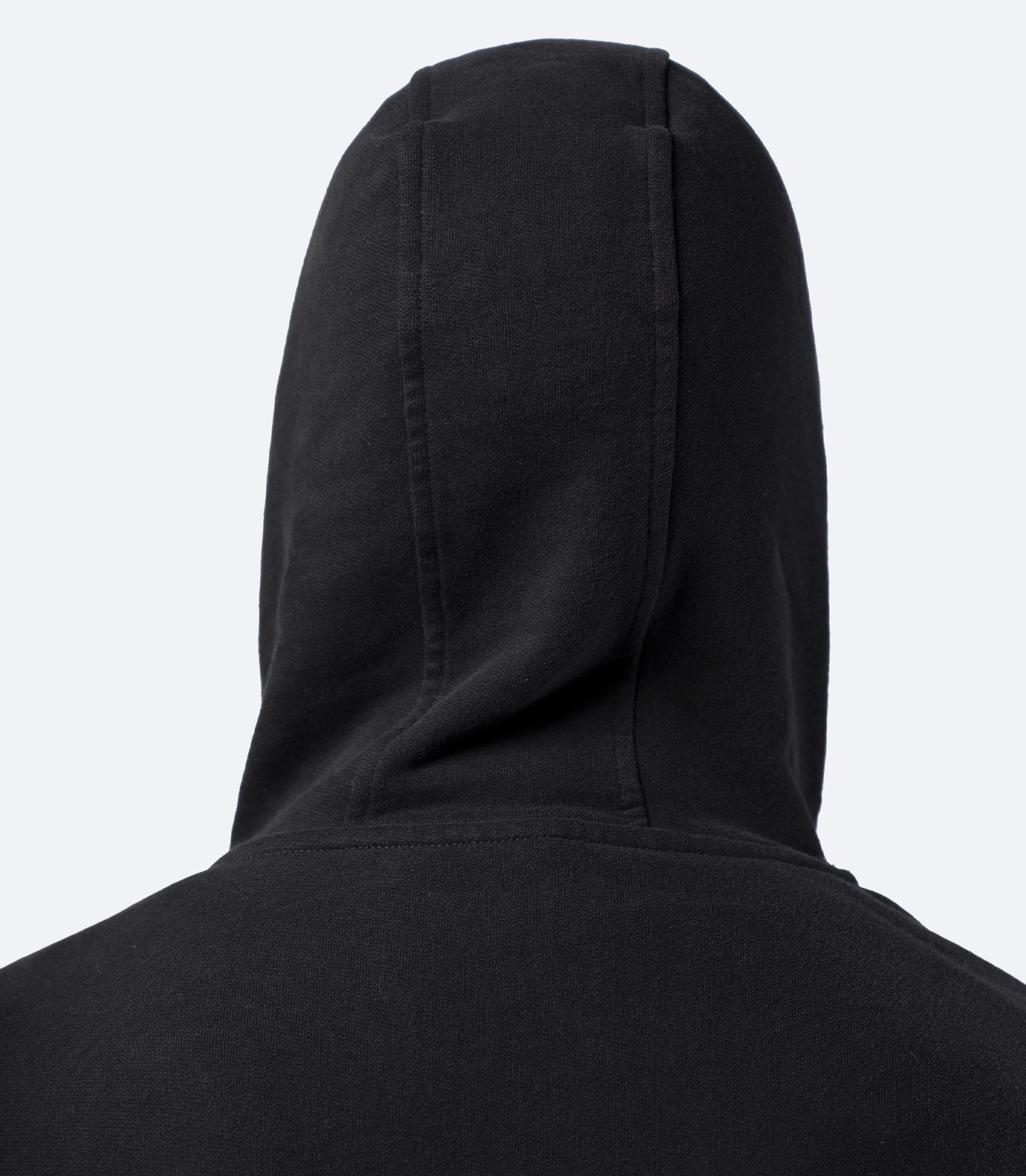 Close-up rear view of black Zhik Men's Carbon Hoodie hood, showing soft cotton construction and clean finish