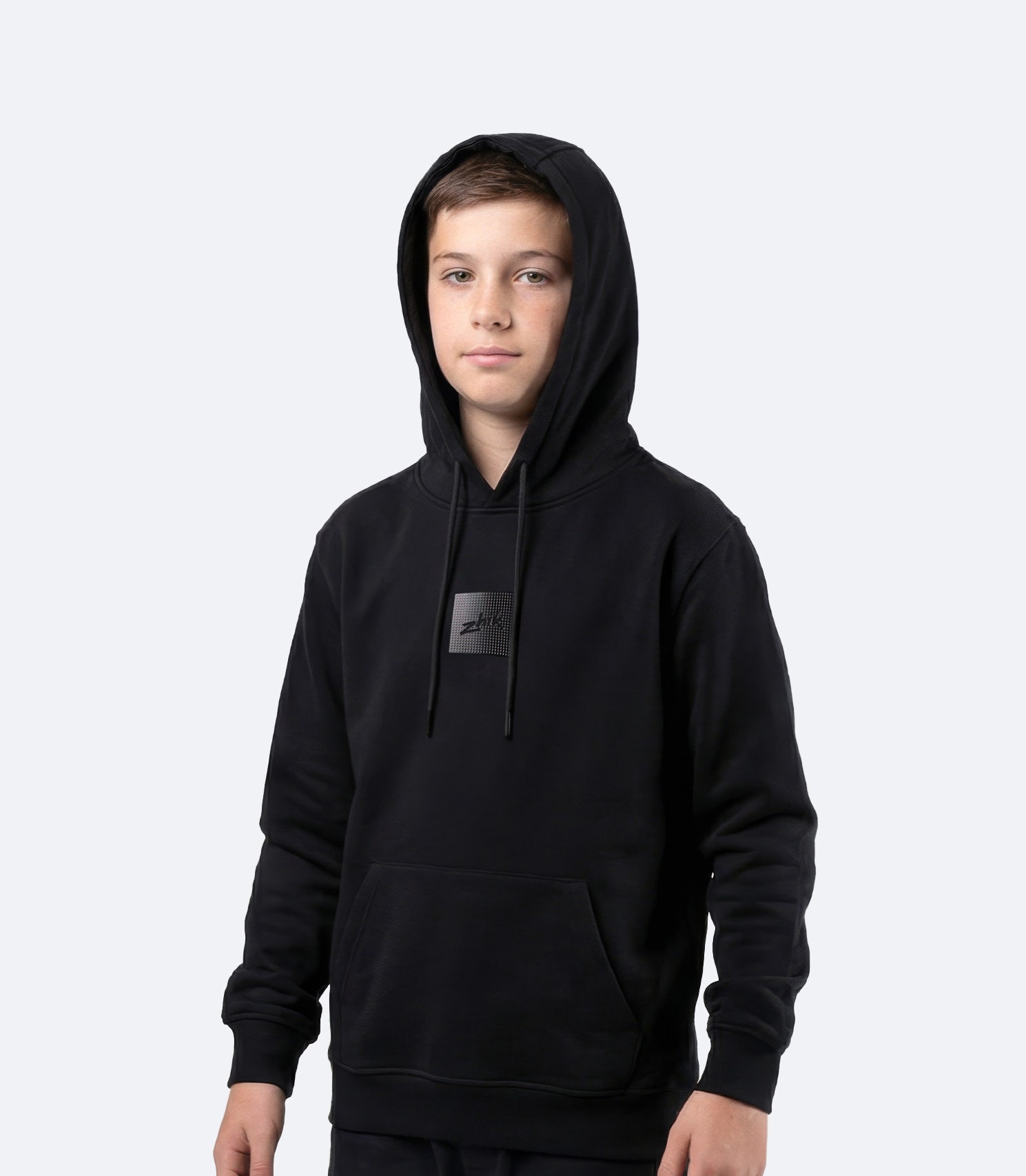 Zhik Youth Carbon Hoodie in Black, front view showing regular fit and classic youth hoodie style