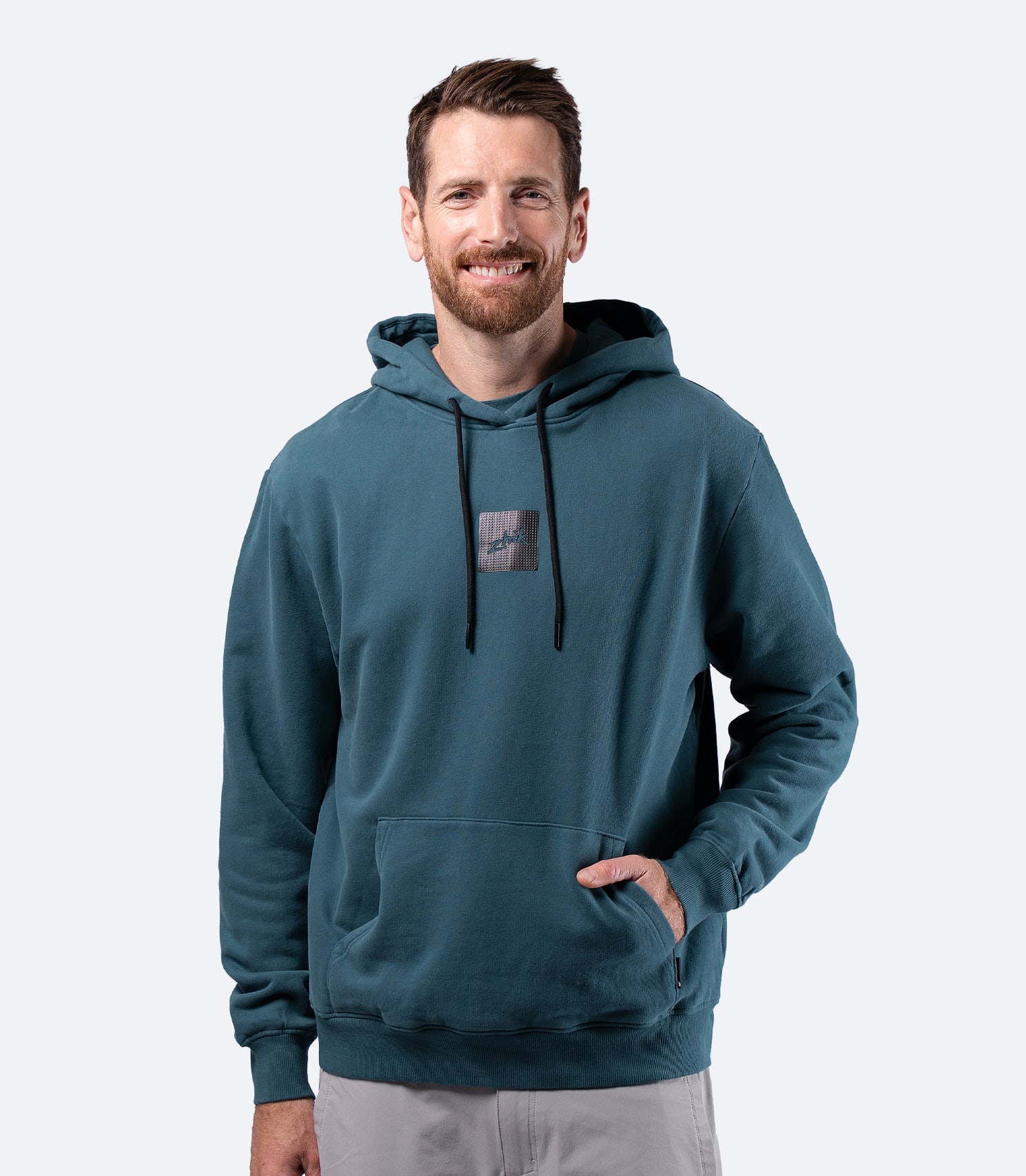 Zhik Men's Carbon Hoodie in Deep Teal, front view with hood down, soft brushed terry backing inside