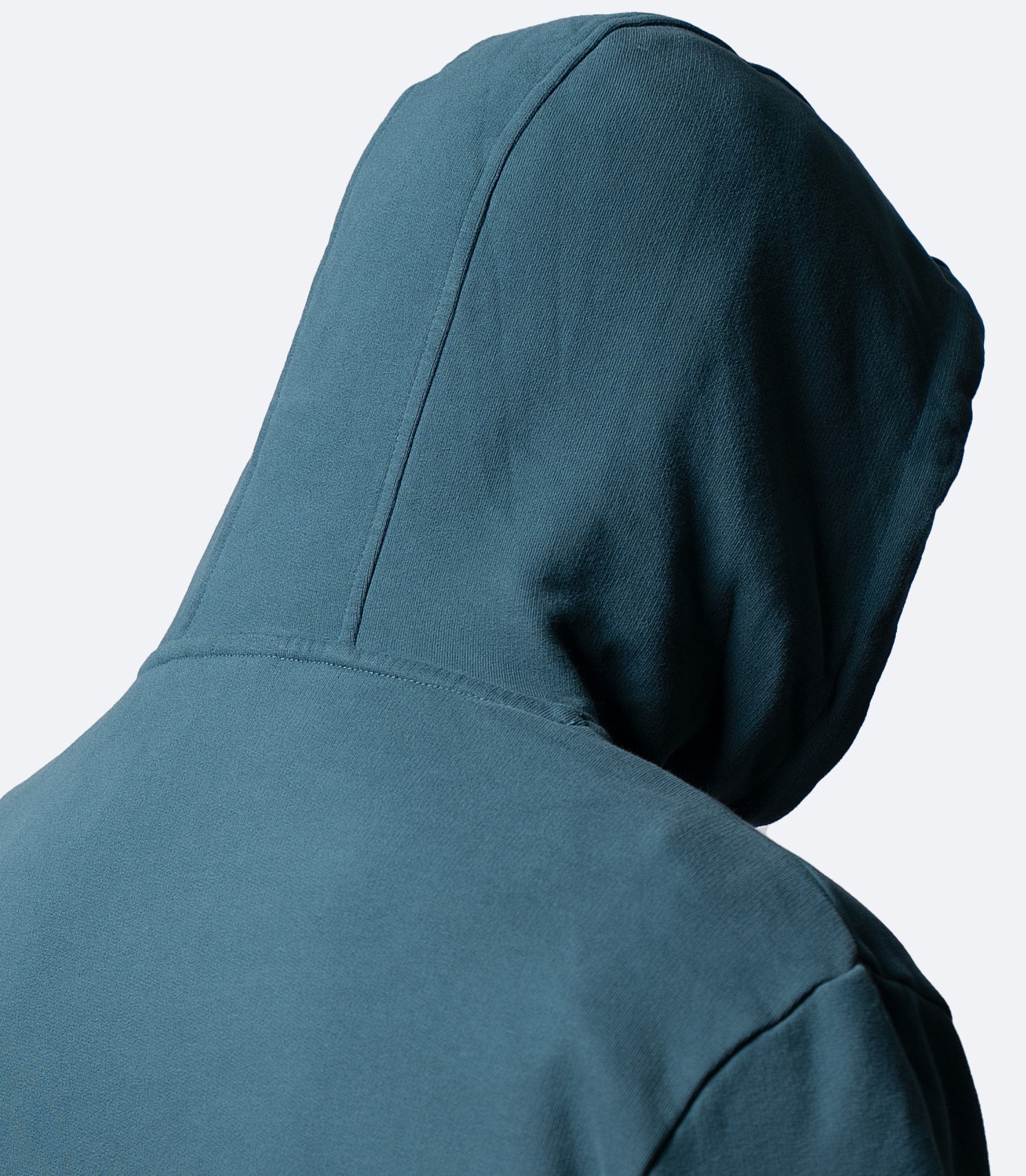 Side close-up of Deep Teal Zhik Men's Carbon Hoodie hood, showing structured silhouette and neat seams