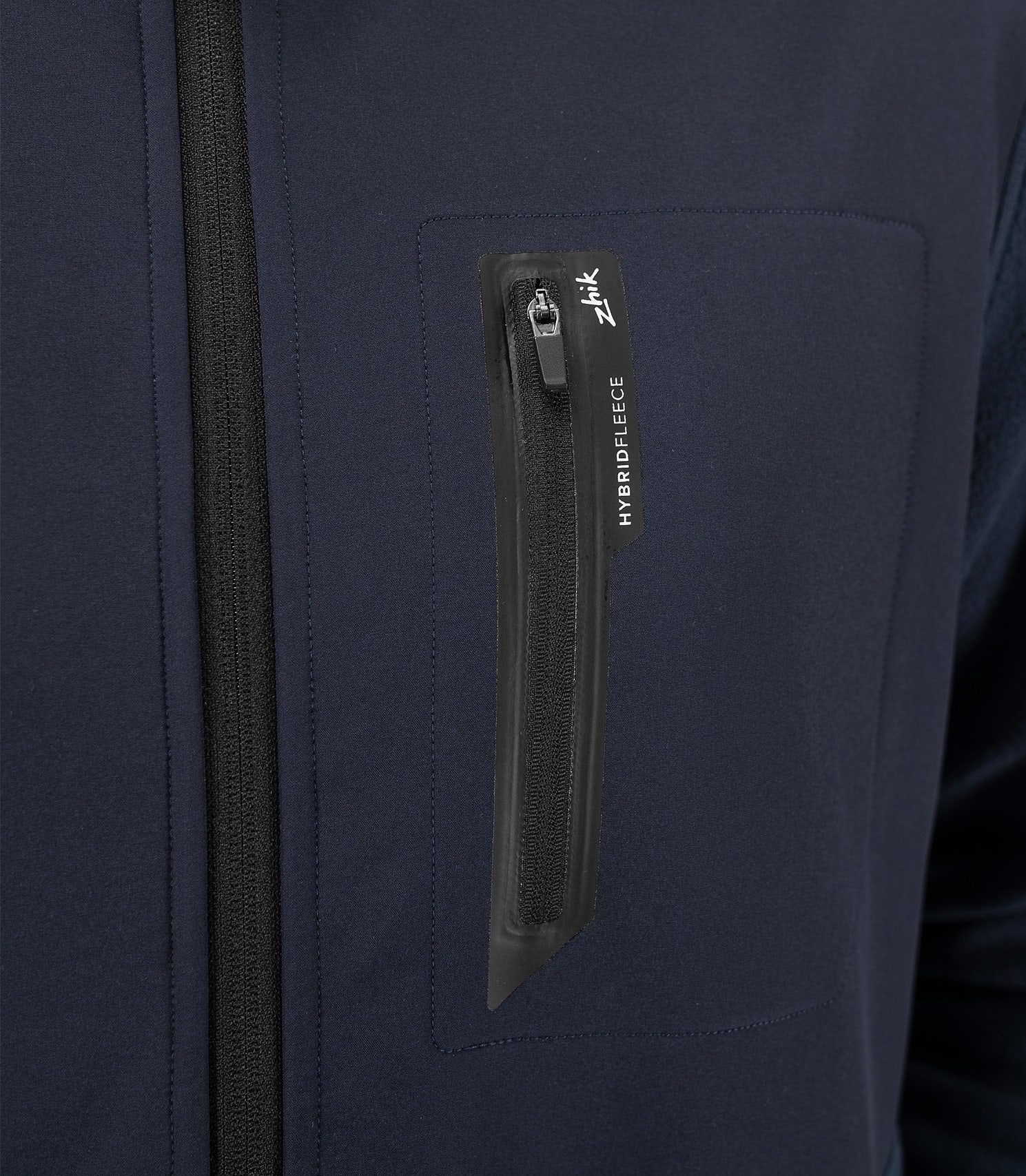 Zhik Men's Hybrid Fleece Jacket in midnight blue with an external chest pocket for easy access and secure storage while sailing or outdoors.