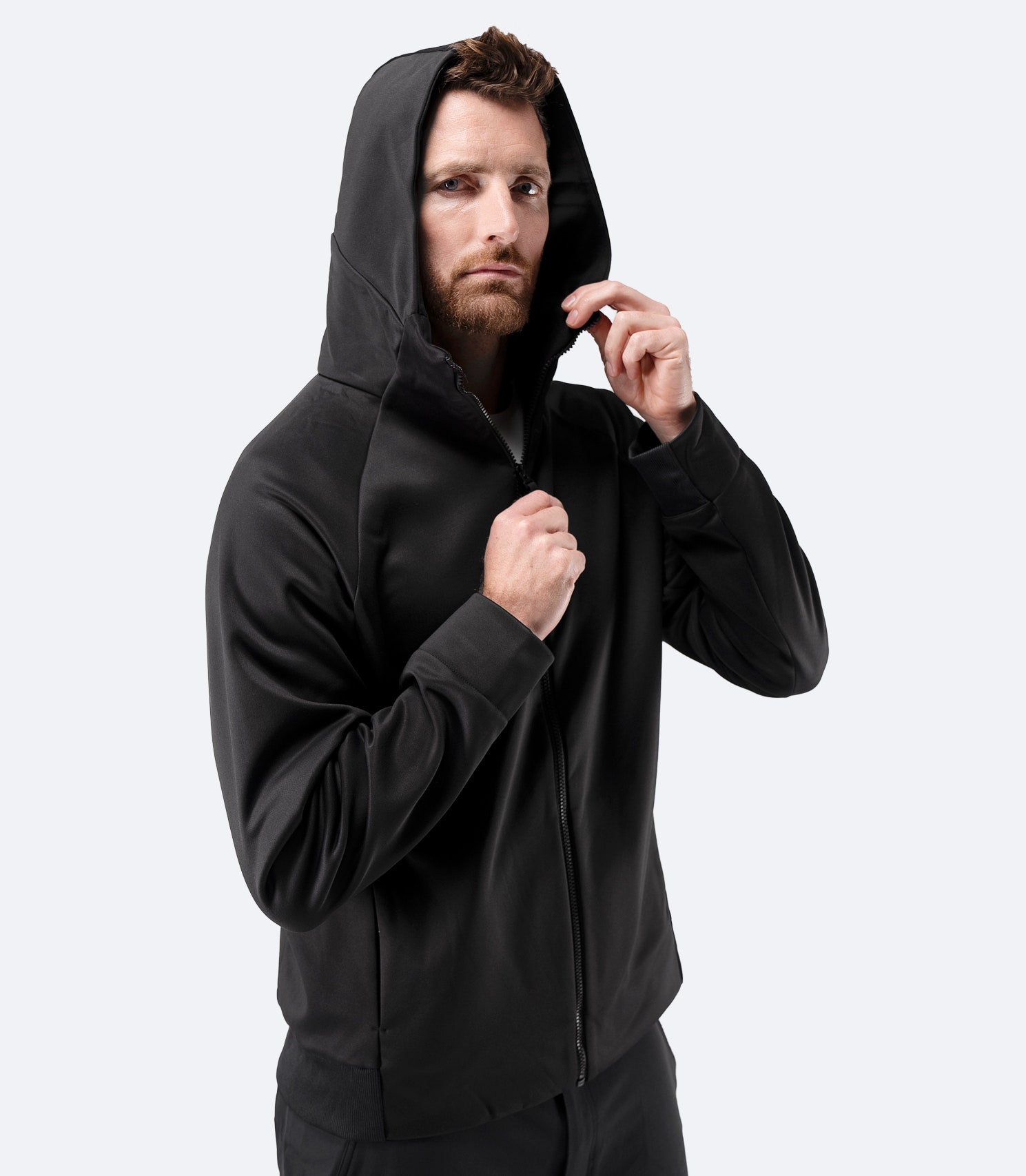 Front view of Zhik Men’s Thermo TechFleece Hooded Jacket in black with hood up