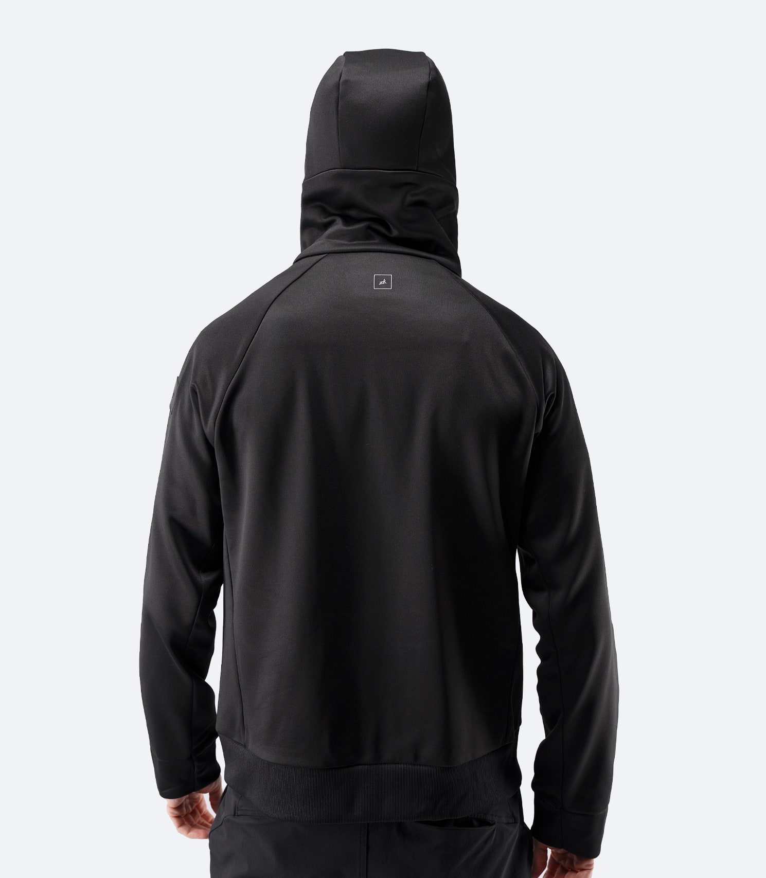 Back view of Zhik Men’s Thermo TechFleece Hooded Jacket in black with hood raised
