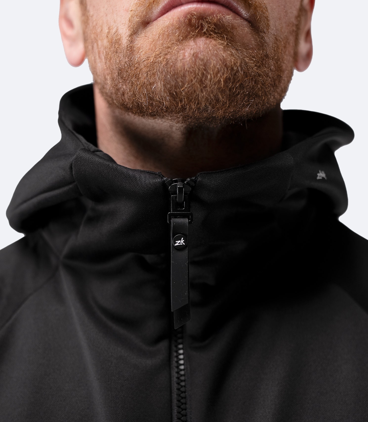 Close-up of hood and collar seam on Zhik Men’s Thermo TechFleece Hooded Jacket in black