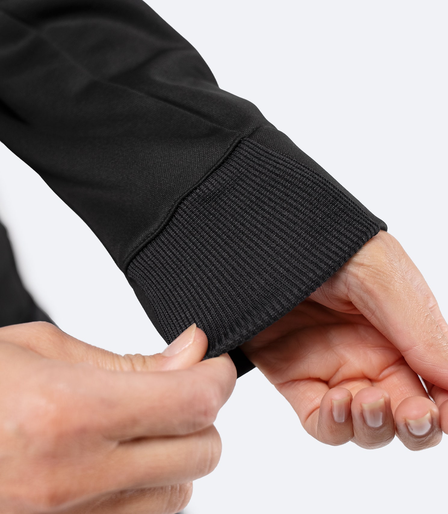 Close-up of sleeve cuff detail on Zhik Women’s Thermo TechFleece Hooded Jacket in black