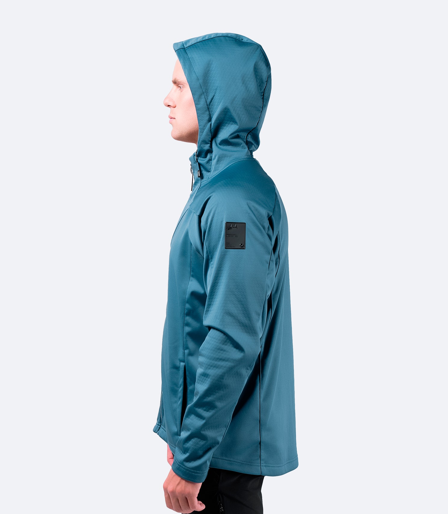 Side view of provincial blue Zhik Men's Tech Hoodie, featuring breathable and high-stretch waterproof panels.