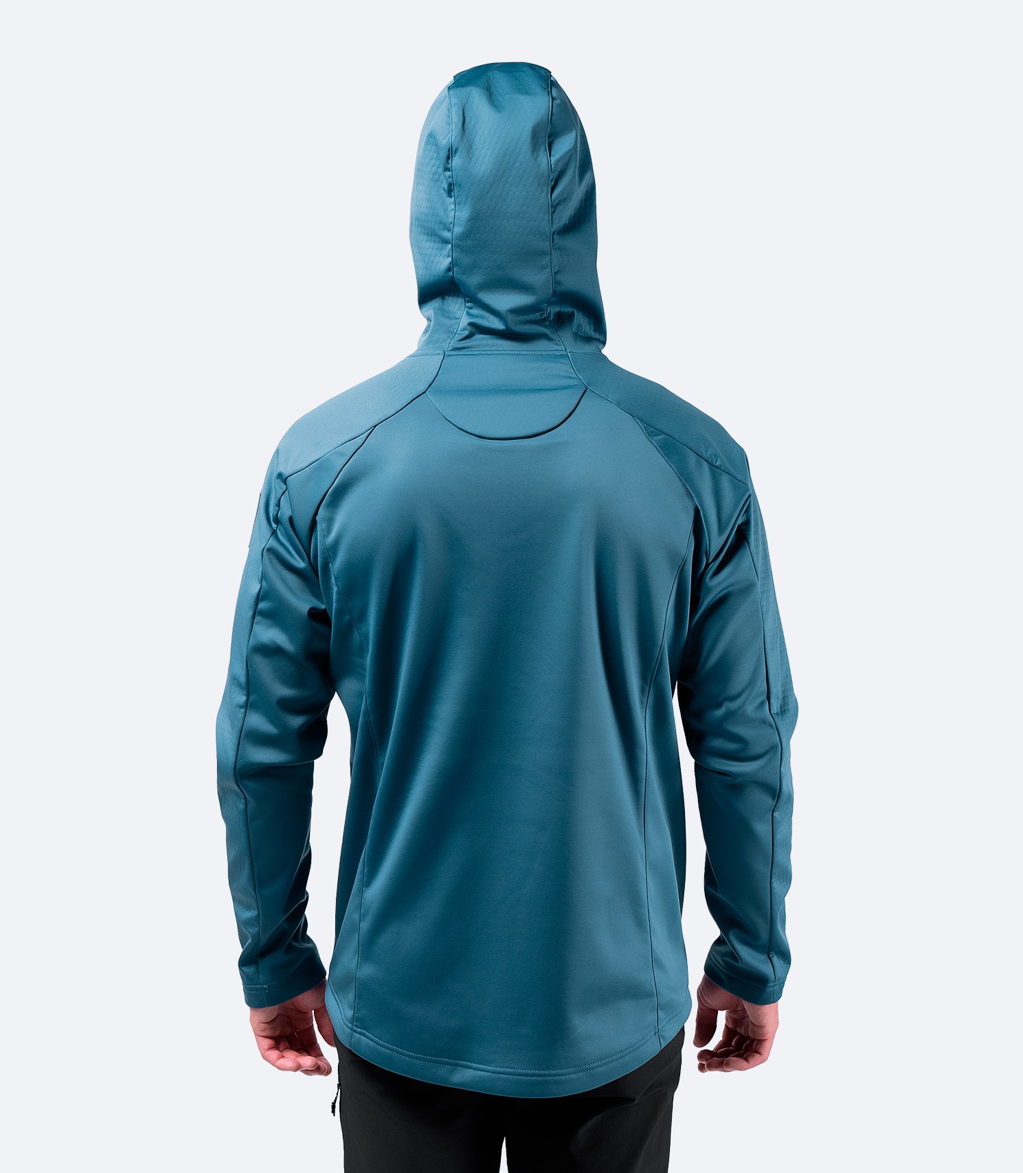 Rear view of provincial blue Zhik Men's Tech Hoodie, displaying ergonomic fit and adjustable hood.