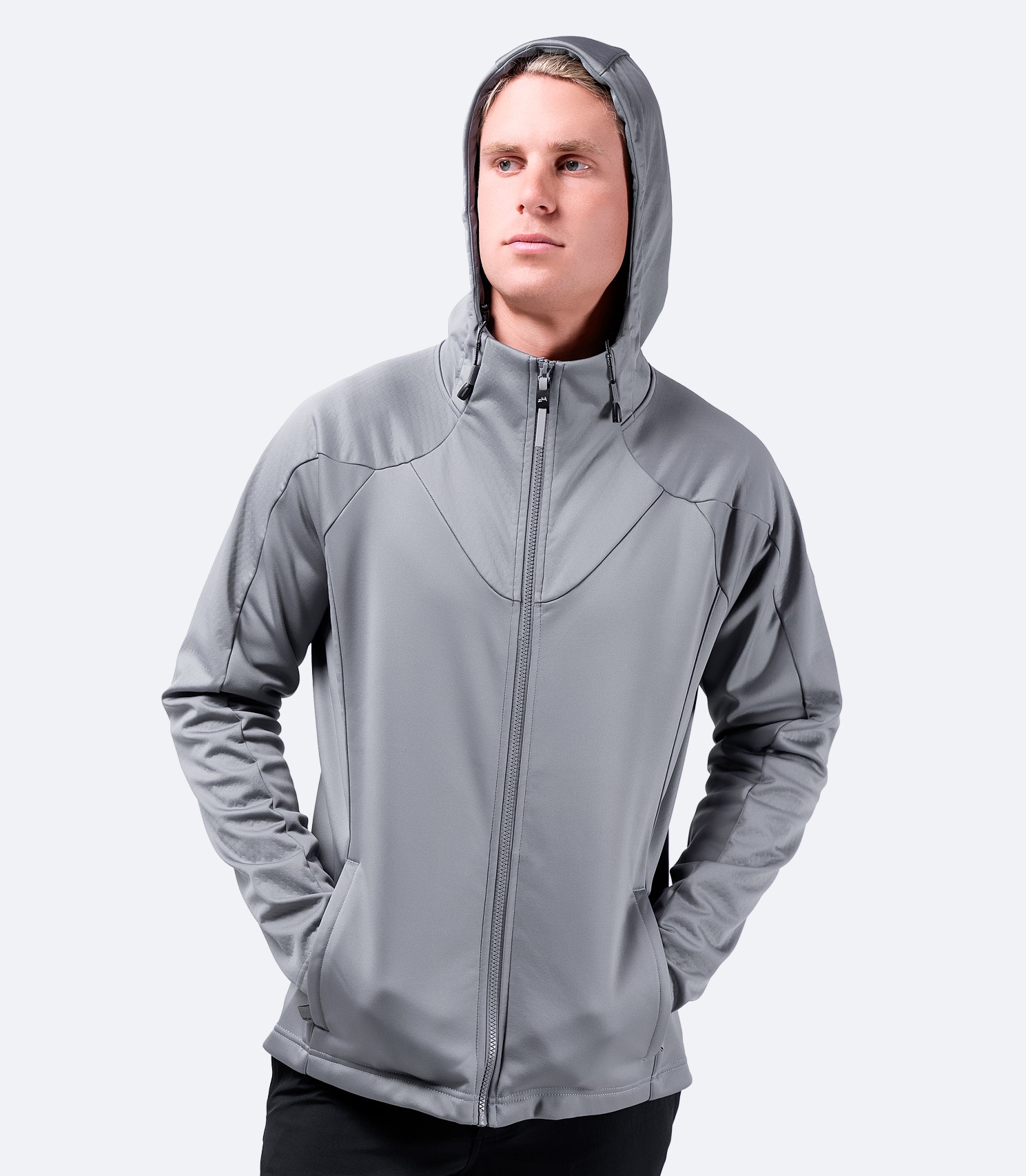 Men’s platinum Tech Hoodie by Zhik, front view worn casually, highlighting active fit and performance styling.