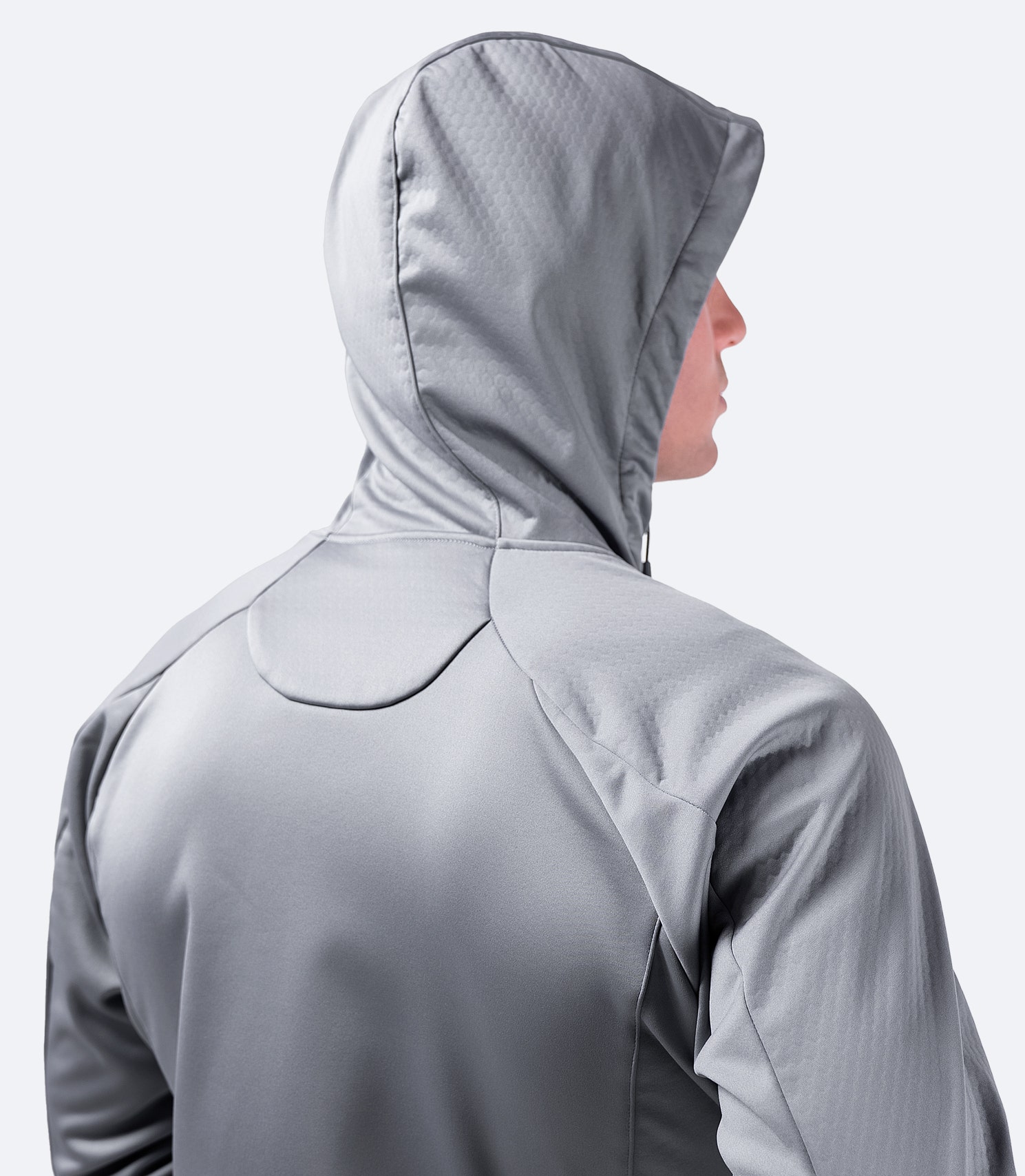 Rear view of platinum Zhik Men's Tech Hoodie, designed with an adjustable hood for performance and comfort.