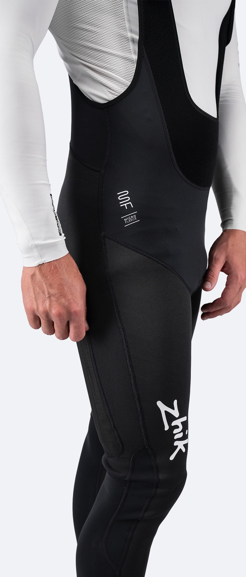 Side view of Zhik Men's Microfleece Hiker in black, highlighting high-rise ZhikTex™ II reinforcement panels and streamlined performance fit