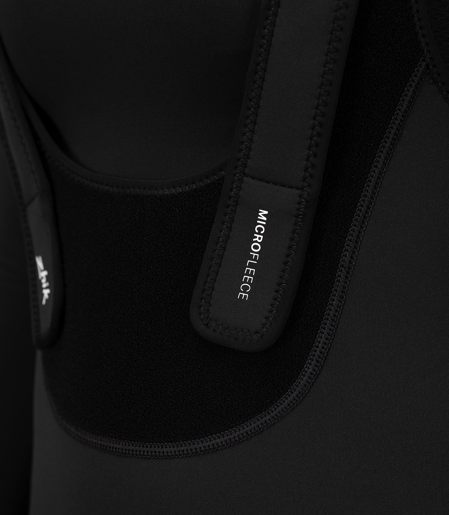 Close-up of Velcro® chest panel on Zhik Women's Microfleece Hiker, showing adjustable straps for a secure and customizable fit.