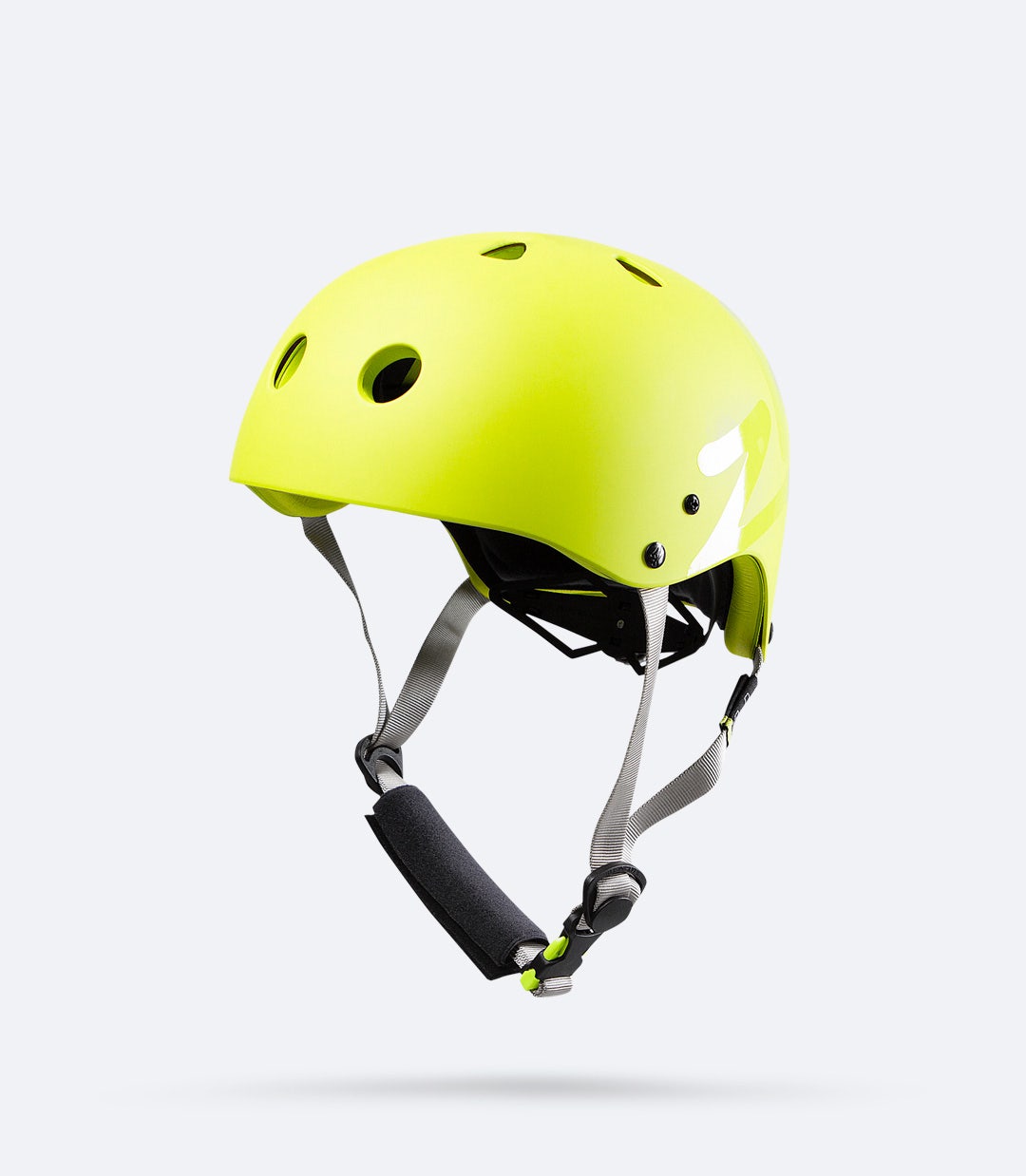 Zhik Junior’s H1™ Helmet in yellow, diagonal side view showing thin profile design and airflow channels for ventilation.
