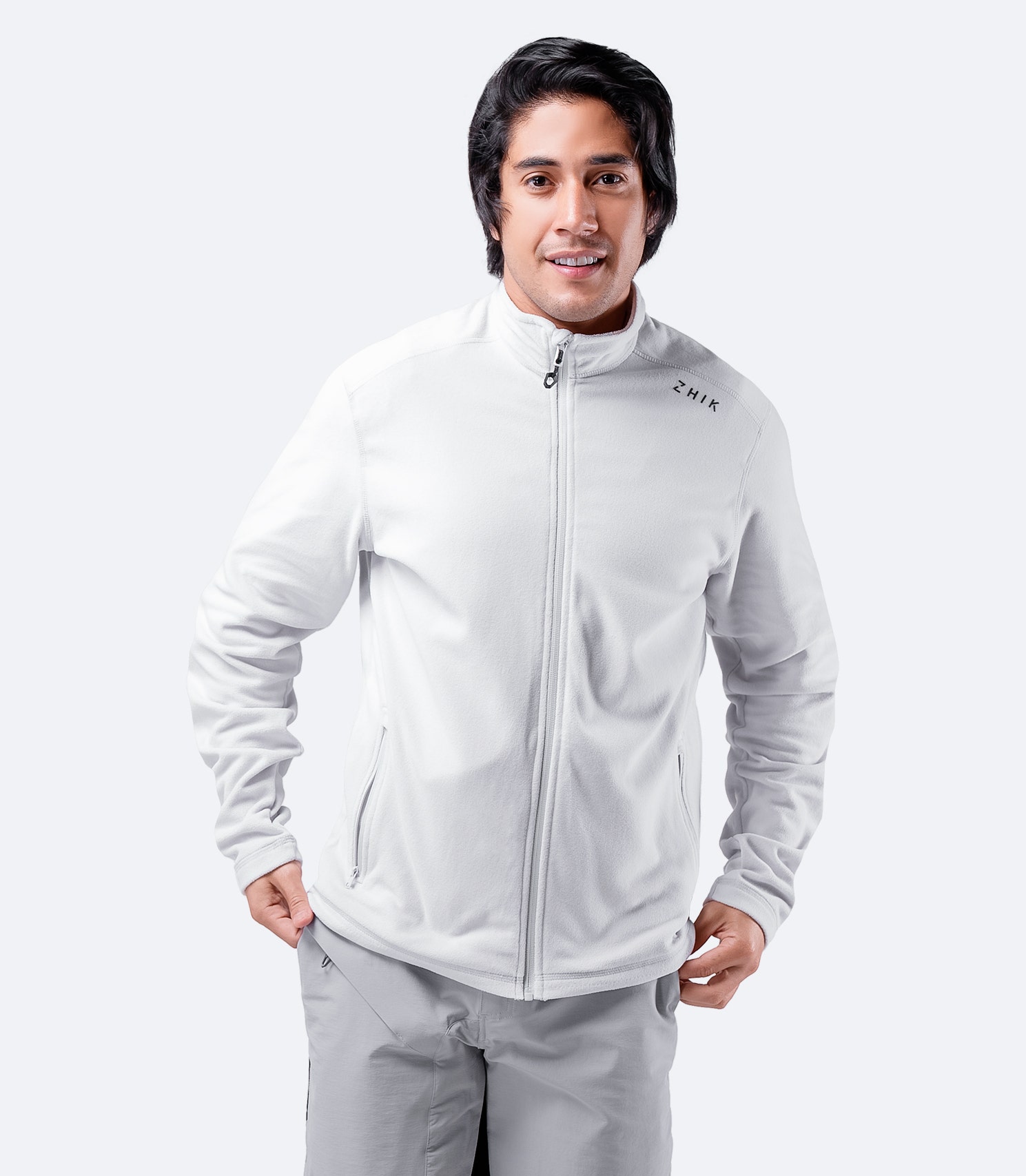 Men’s Platinum Full Zip Fleece Jacket worn casually, showcasing its versatile mid-layer design for outdoor and sailing use.