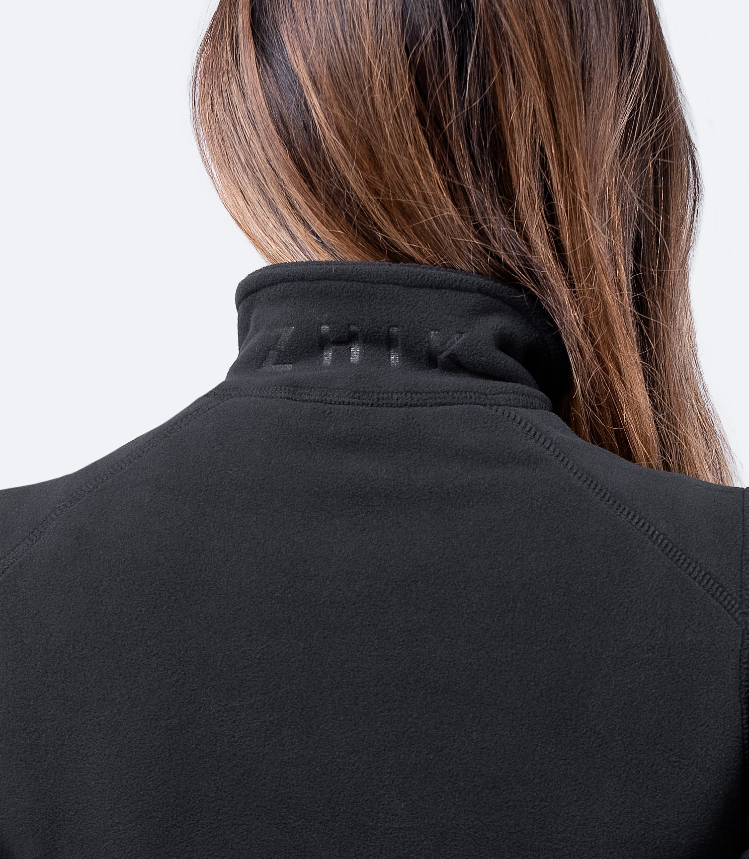 Rear view of Women's Black Full Zip Fleece Jacket – high collar and form-holding microfleece for superior insulation.