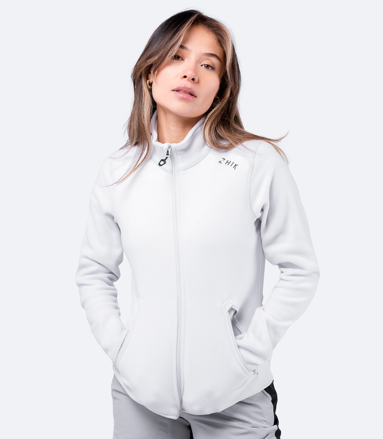Women's Platinum Full Zip Fleece Jacket with hands in pockets – soft, recycled microfleece for all-day wear.