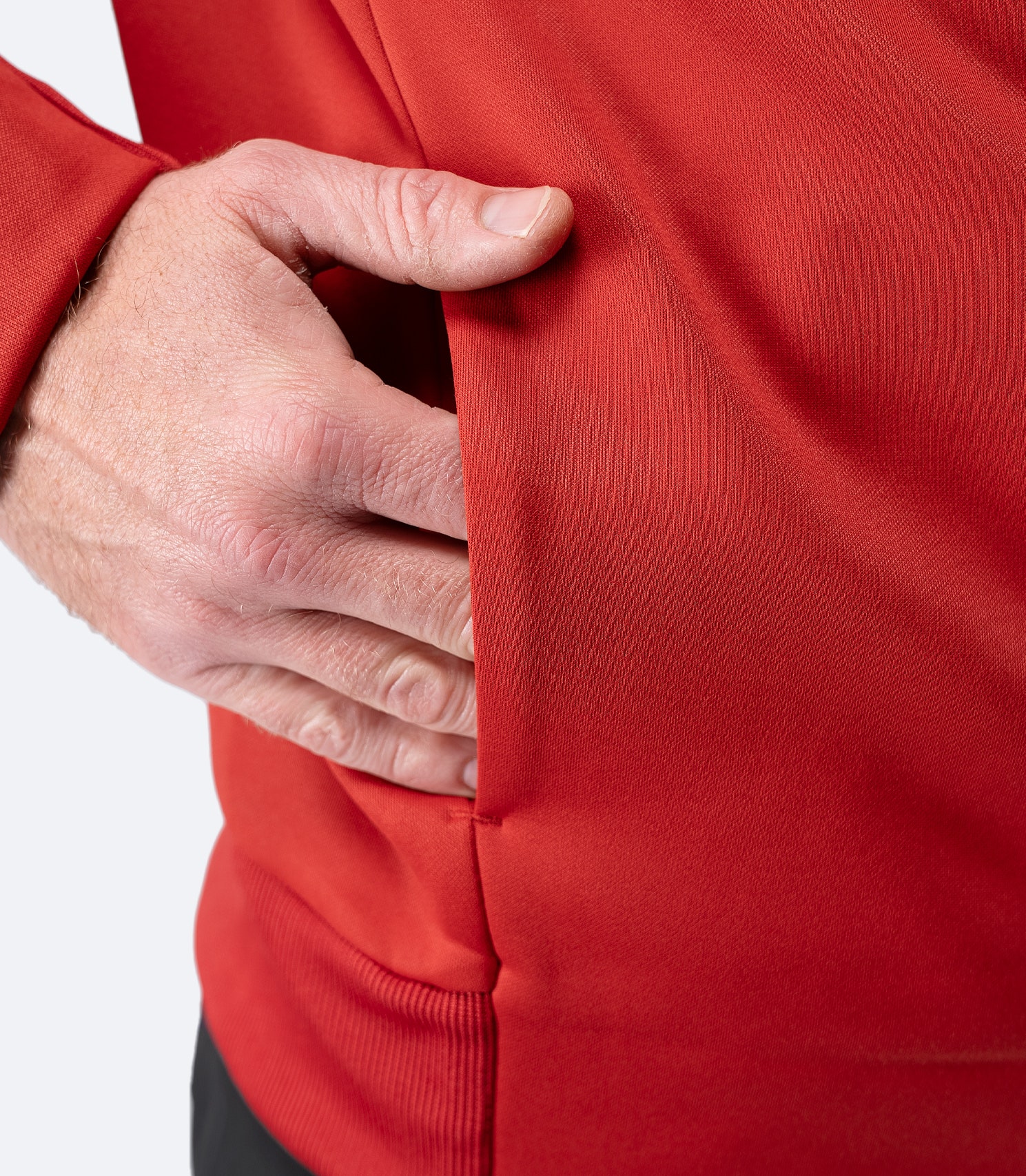 Close-up of side pocket on Zhik Men’s Thermo TechFleece Sports Jacket in garnet red