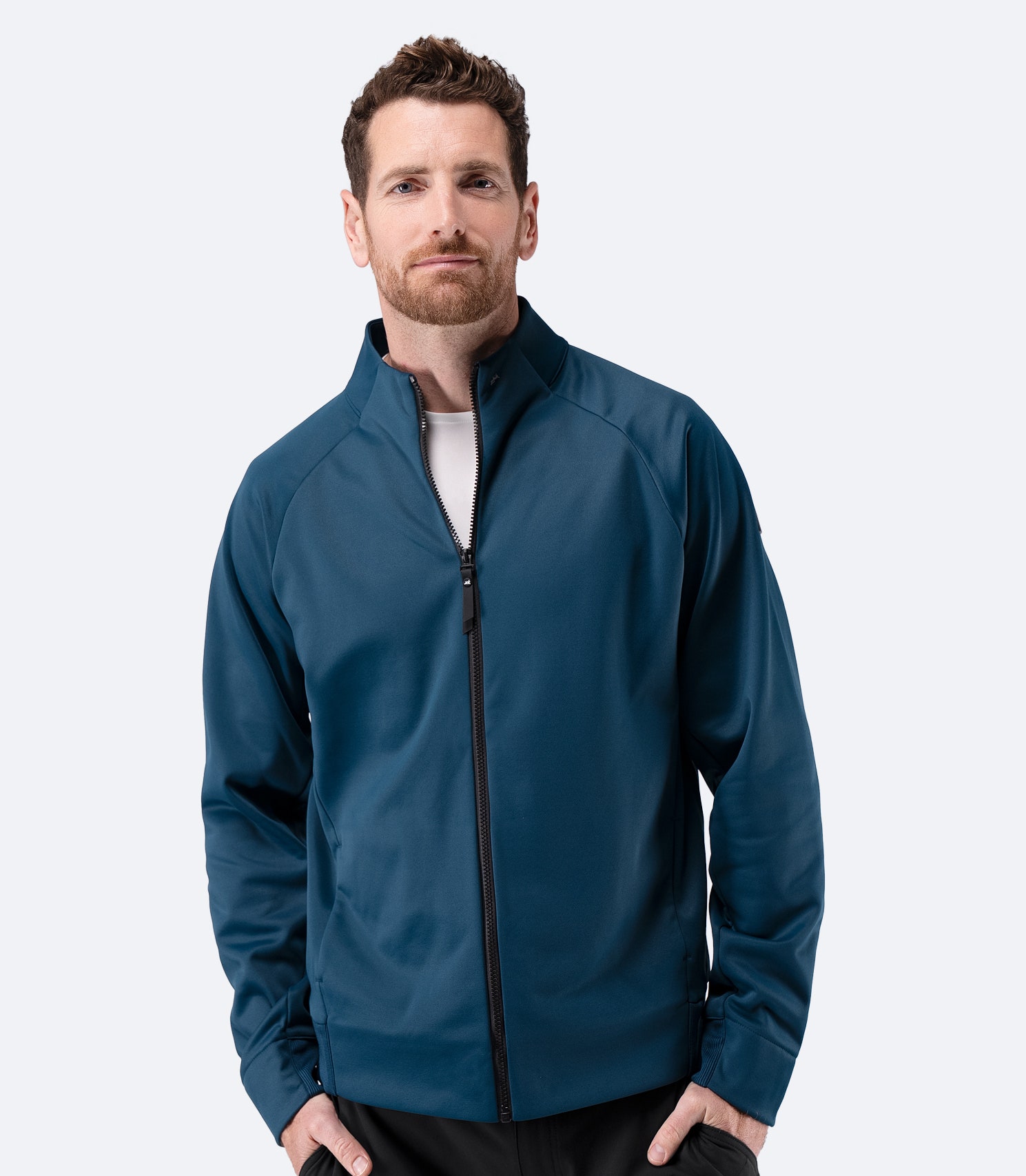 Front view of Zhik Men’s Thermo TechFleece Sports Jacket in deep teal, zipped up