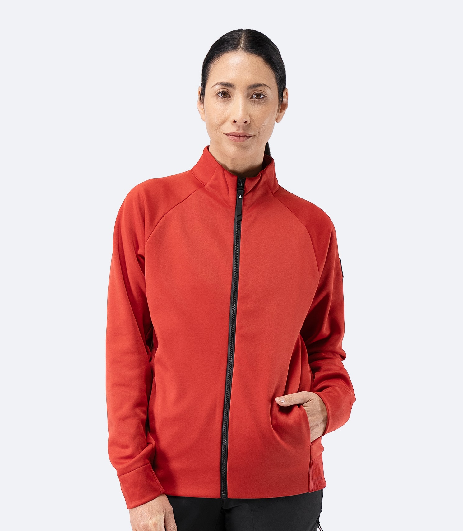 Front view of Zhik Women’s Thermo TechFleece Sports Jacket in garnet red, zipped up