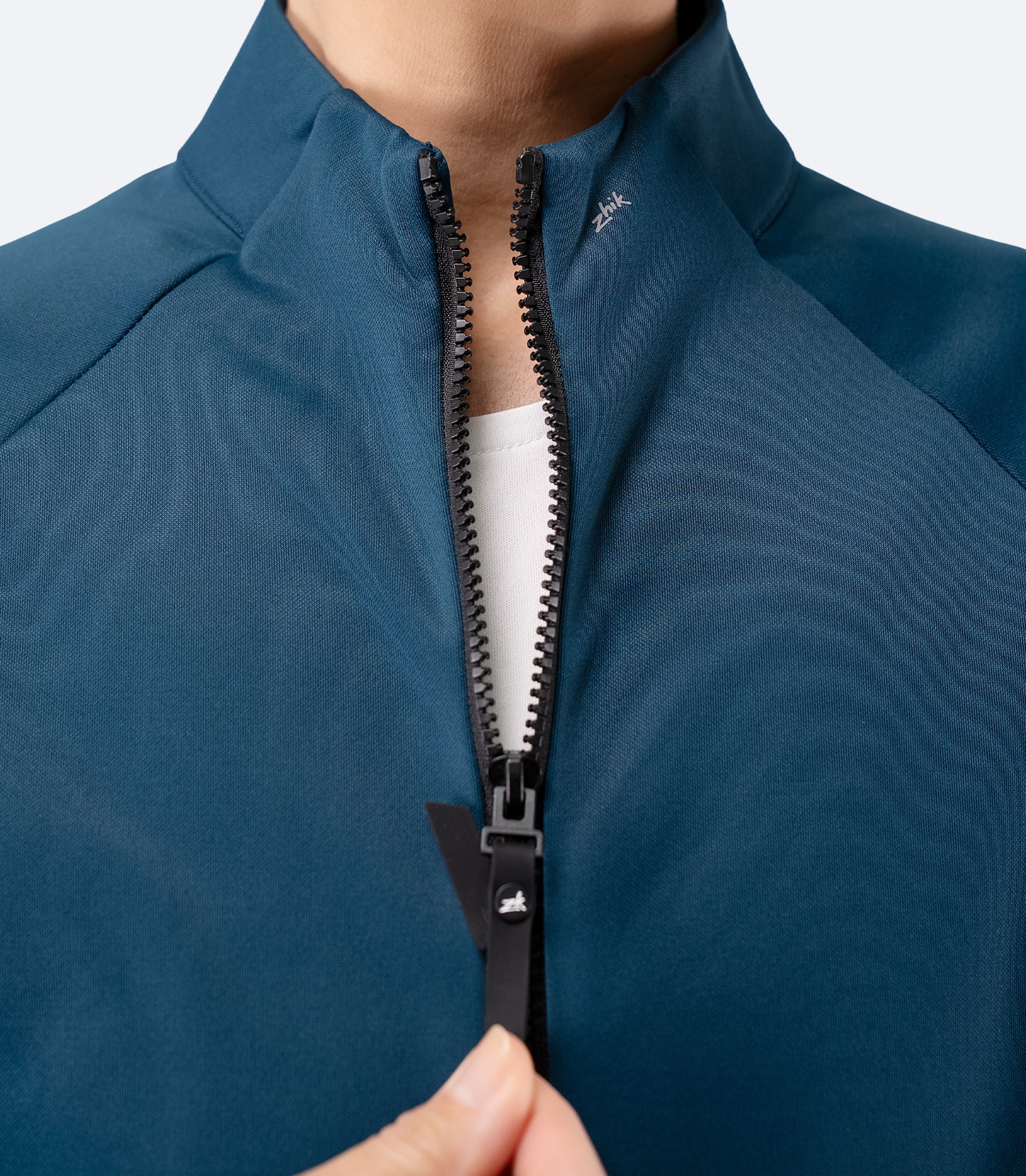 Close-up of zipper and collar detail on Zhik Women’s Thermo TechFleece Sports Jacket