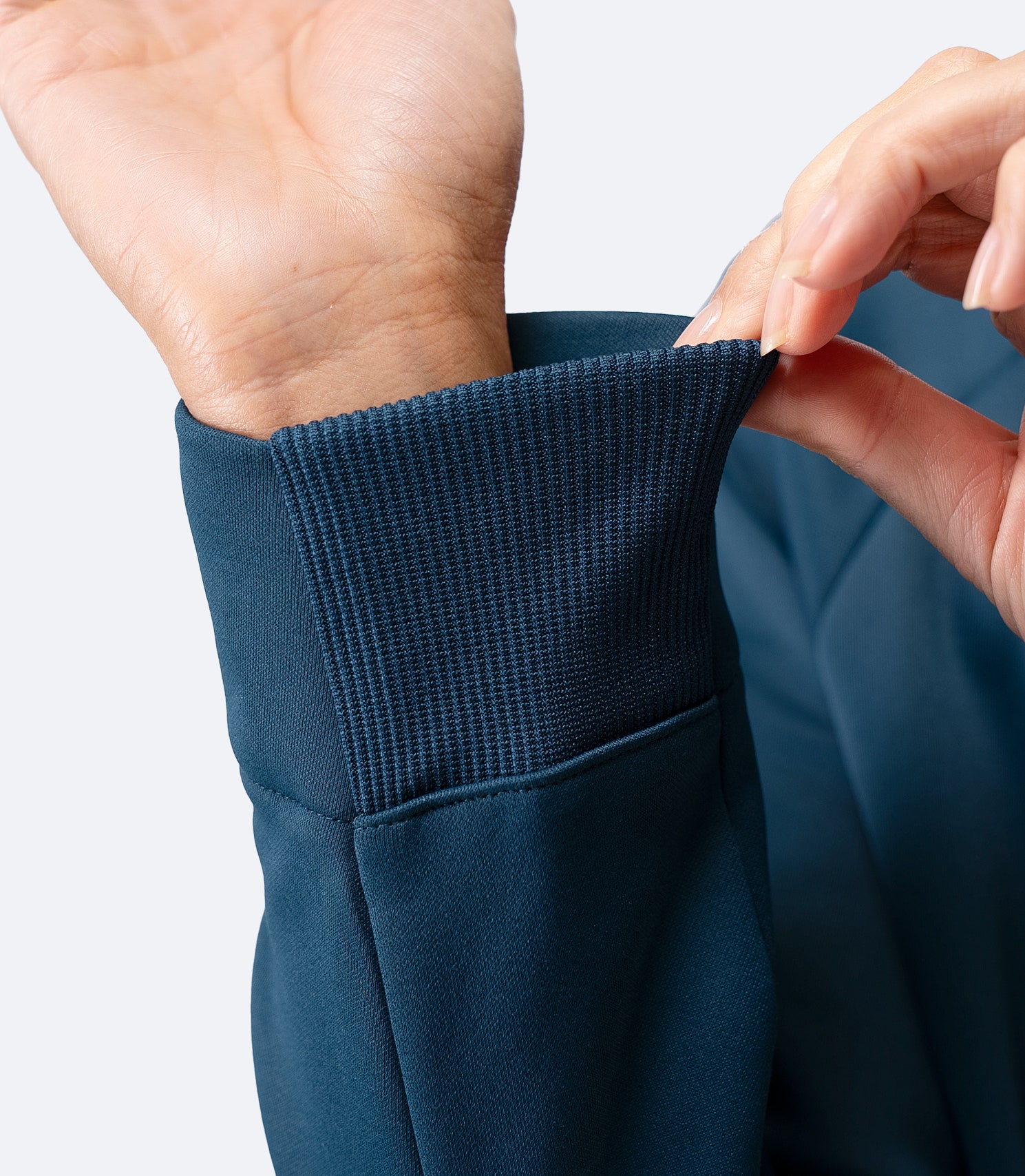 Close-up of sleeve cuff detail on Zhik Women’s Thermo TechFleece Sports Jacket in deep teal