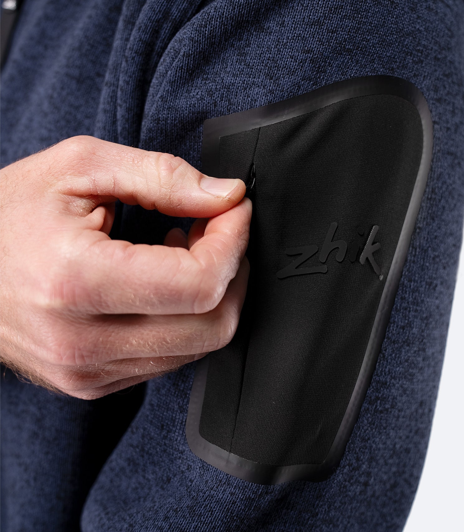 Close-up of zippered arm pocket detail on Zhik Men’s Knit Fleece Jacket