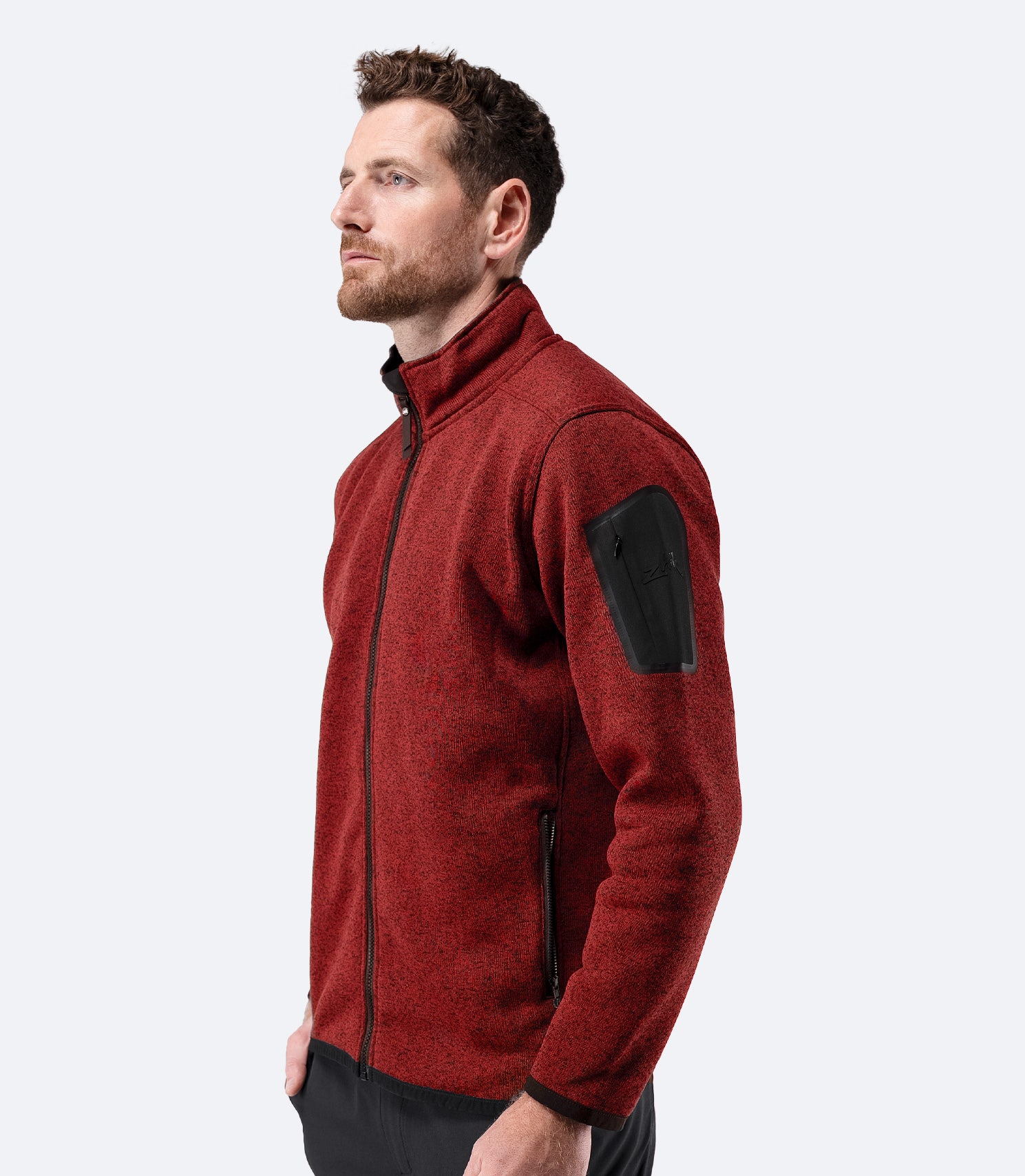 Side profile of Zhik Men’s Knit Fleece Jacket in garnet marle with arm pocket