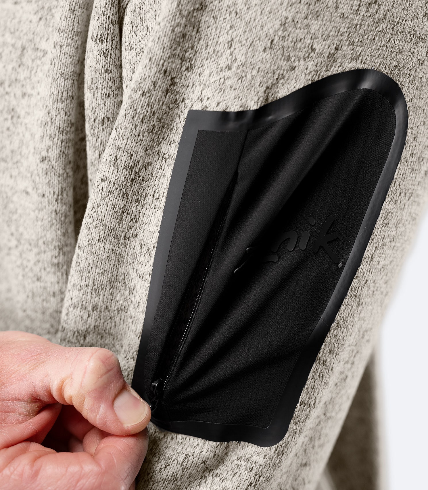 Close-up of zippered arm pocket on Zhik Men’s Knit Fleece Jacket
