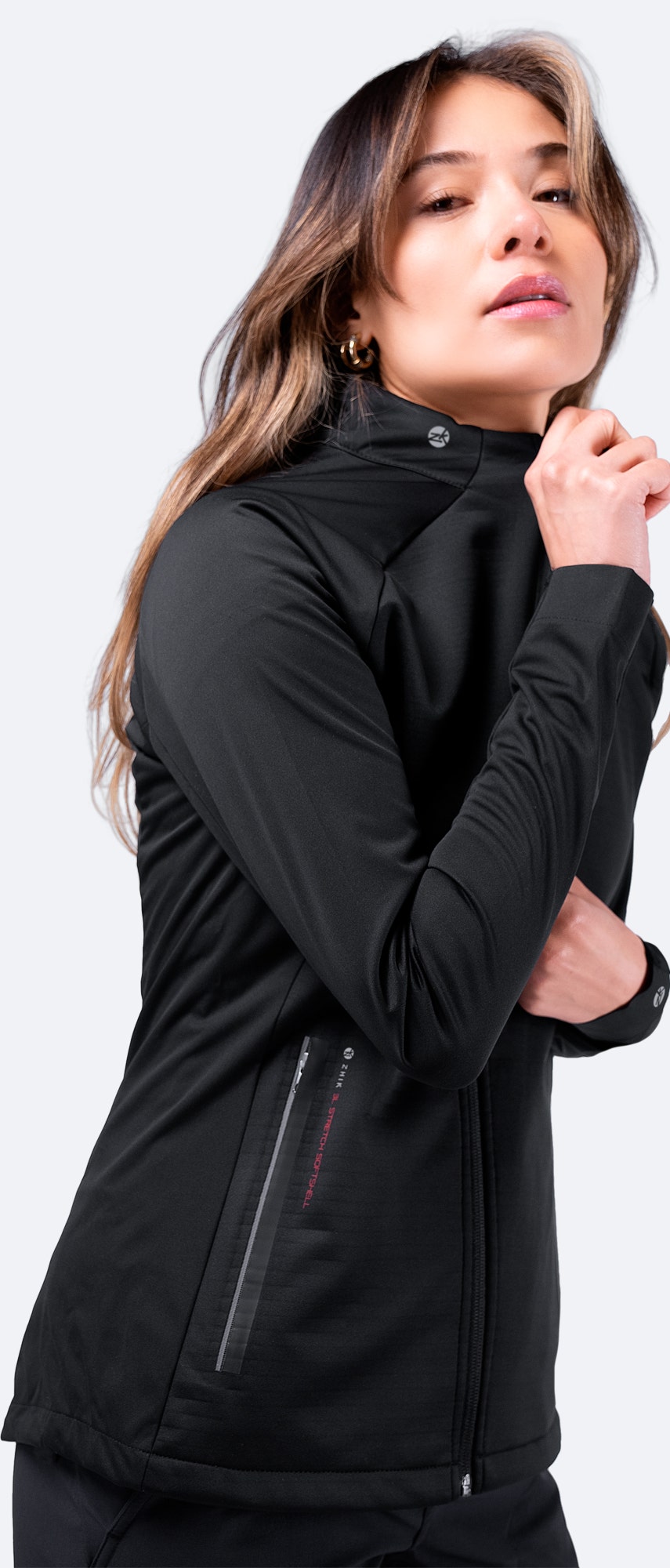 Front view of Zhik Women's 3L Softshell Jacket in black, zipped up with a fitted high collar for wind protection and a slim technical fit.