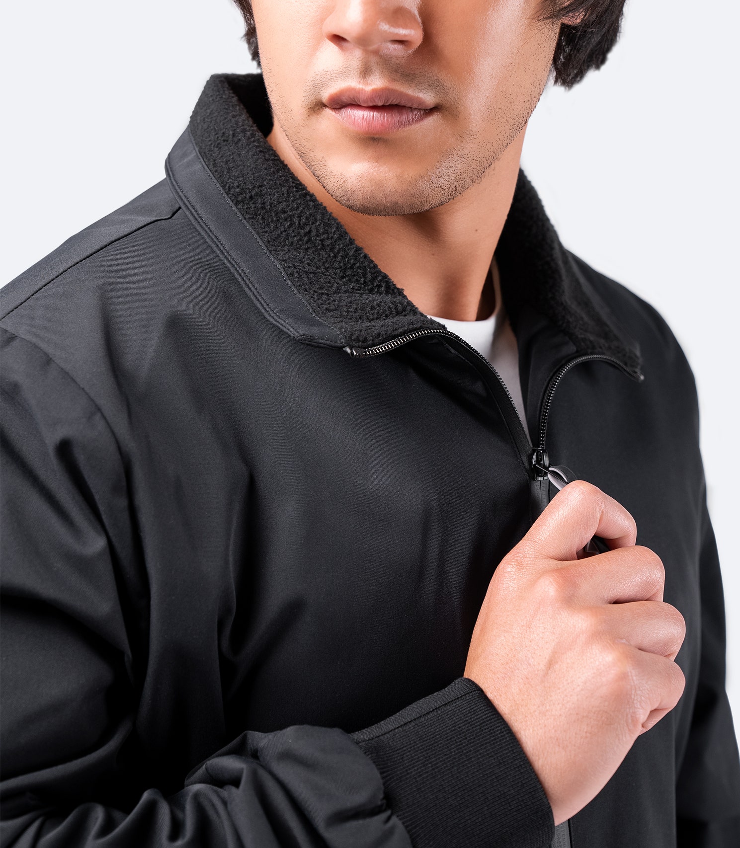 Close-up of the black Men's Flight Jacket – mid-height fleece collar, reinforced wrists, and durable water-resistant fabric.