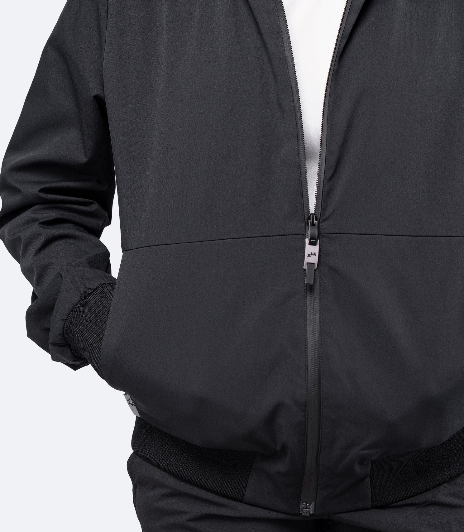 Close-up of side pocket on the black Women's Flight Jacket, designed for secure storage.