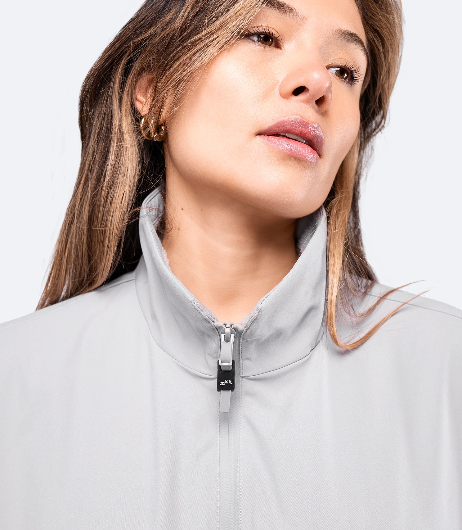 Close-up of platinum Women's Flight Jacket collar, featuring fleece lining and smooth twill fabric.