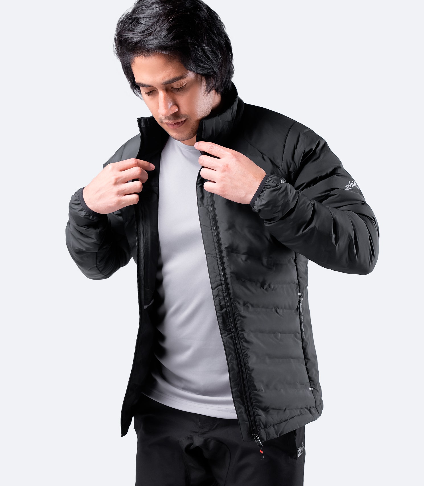 Men's Black Zhik Cell™ Insulated Jacket unzipped, revealing internal stash pockets and fleece lining.