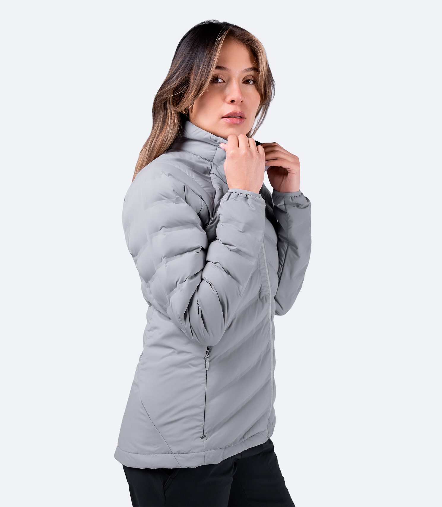 Side view of Women's Platinum Cell™ Insulated Jacket showcasing sleek fit, fused baffling, and reflective detailing.