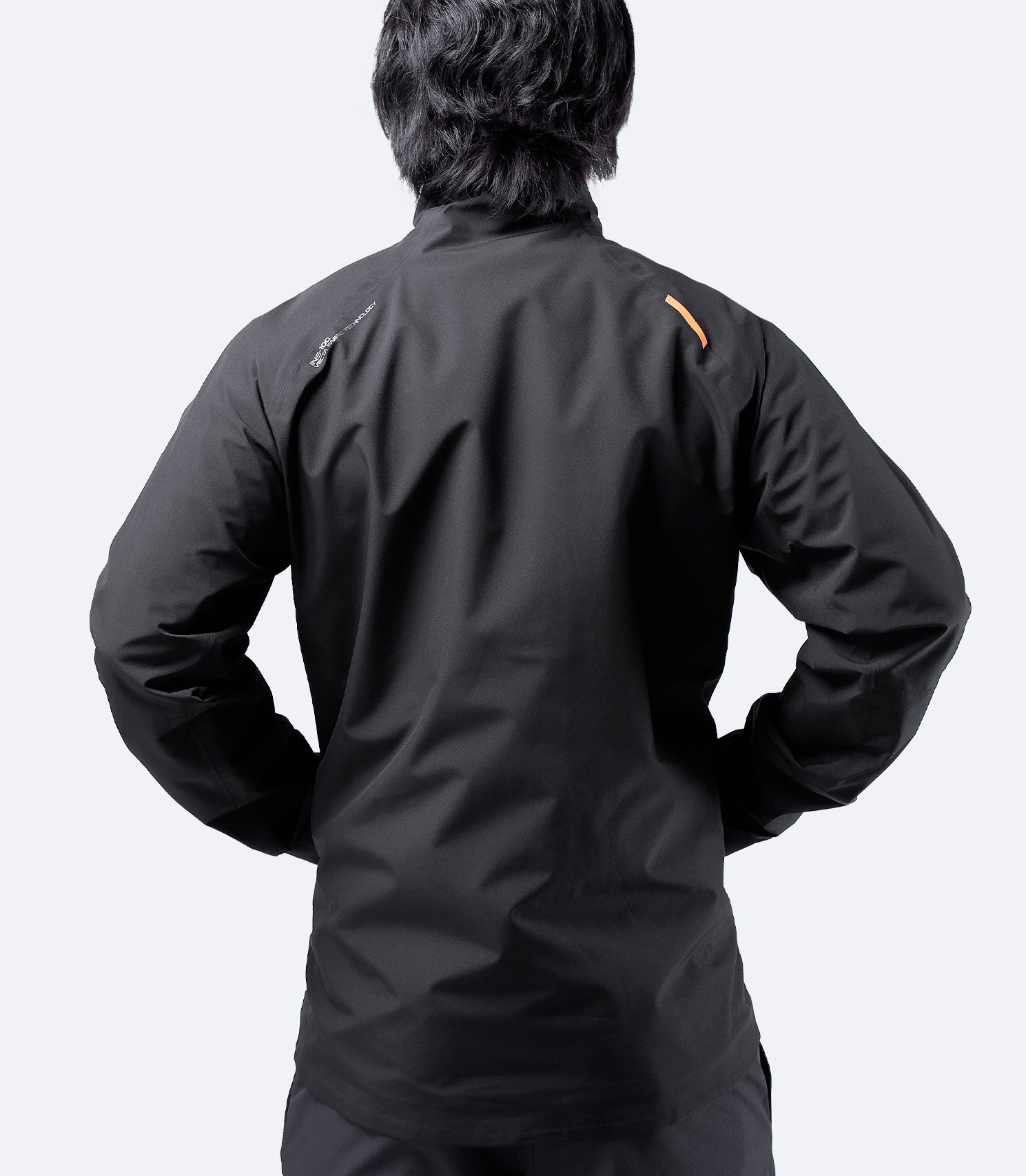 Back view of Zhik Men's INS100™ Jacket in Black, featuring fully taped seams, sculpted fit, and pre-formed cuffs for freedom of movement.