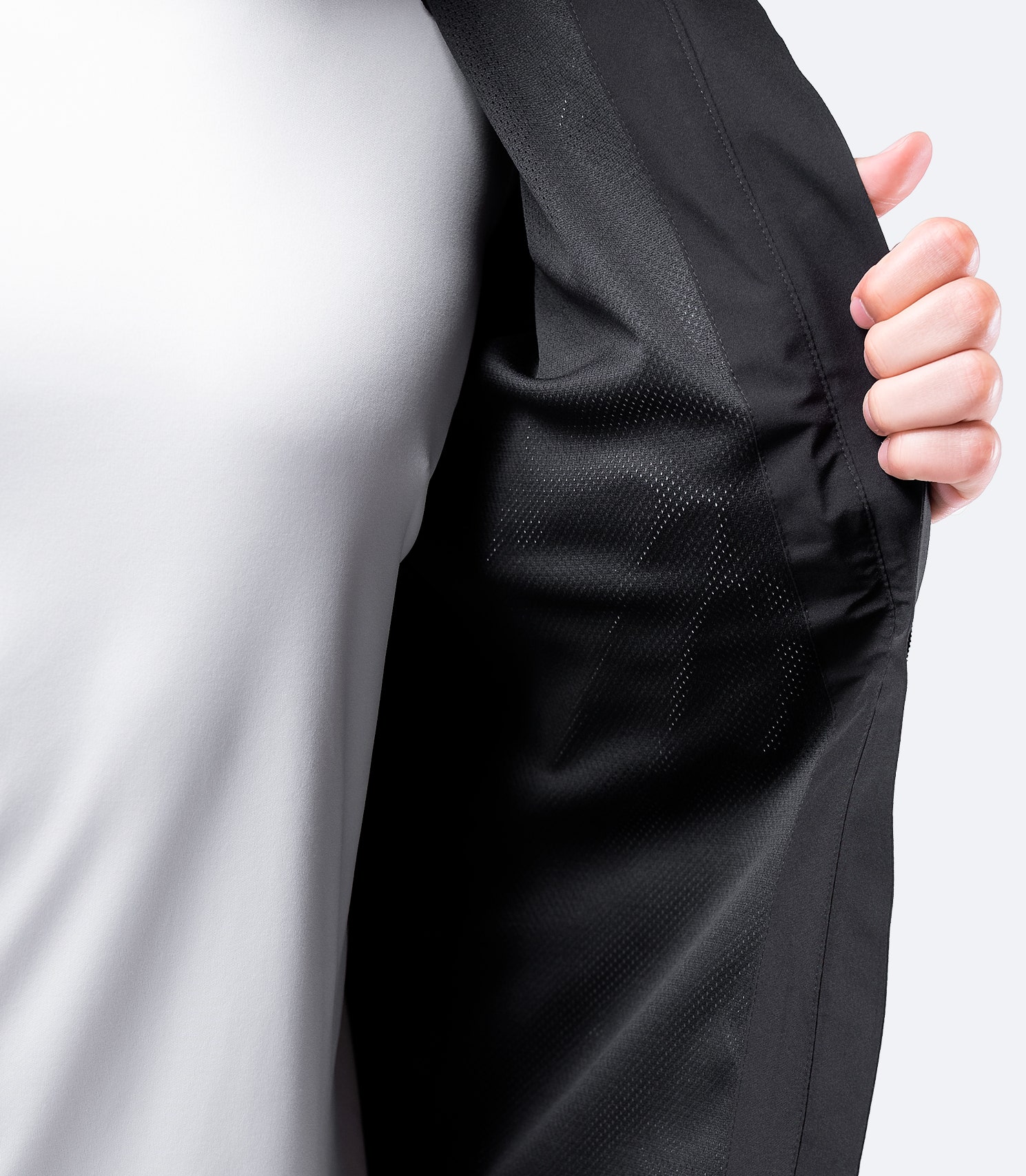 Inner lining of Zhik Men's INS100™ Jacket in Black, featuring soft mesh fabric for breathability, temperature regulation, and airflow.