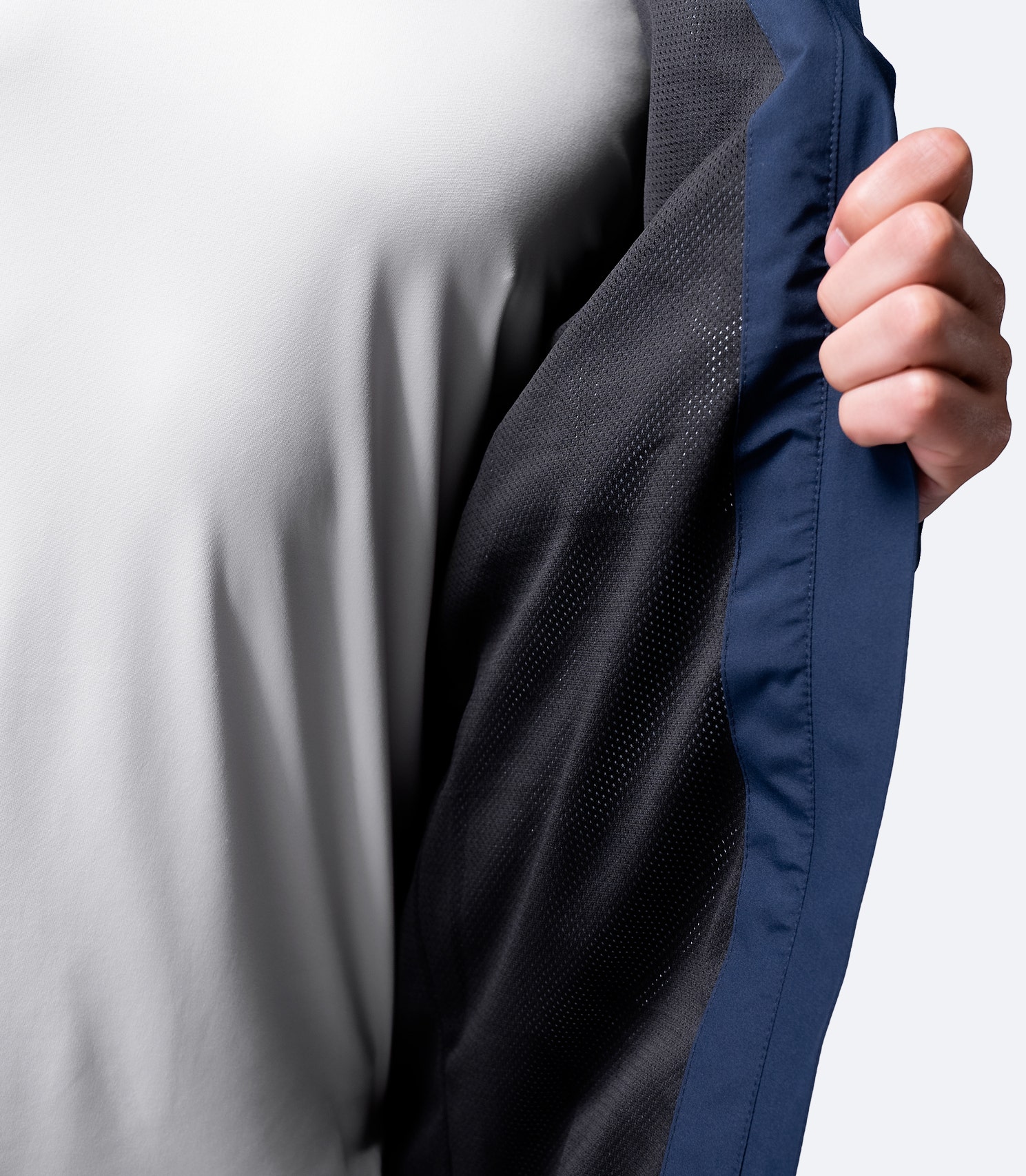 Inner lining of Zhik Men's INS100™ Jacket in Navy, featuring soft mesh fabric for breathability, temperature regulation, and airflow.