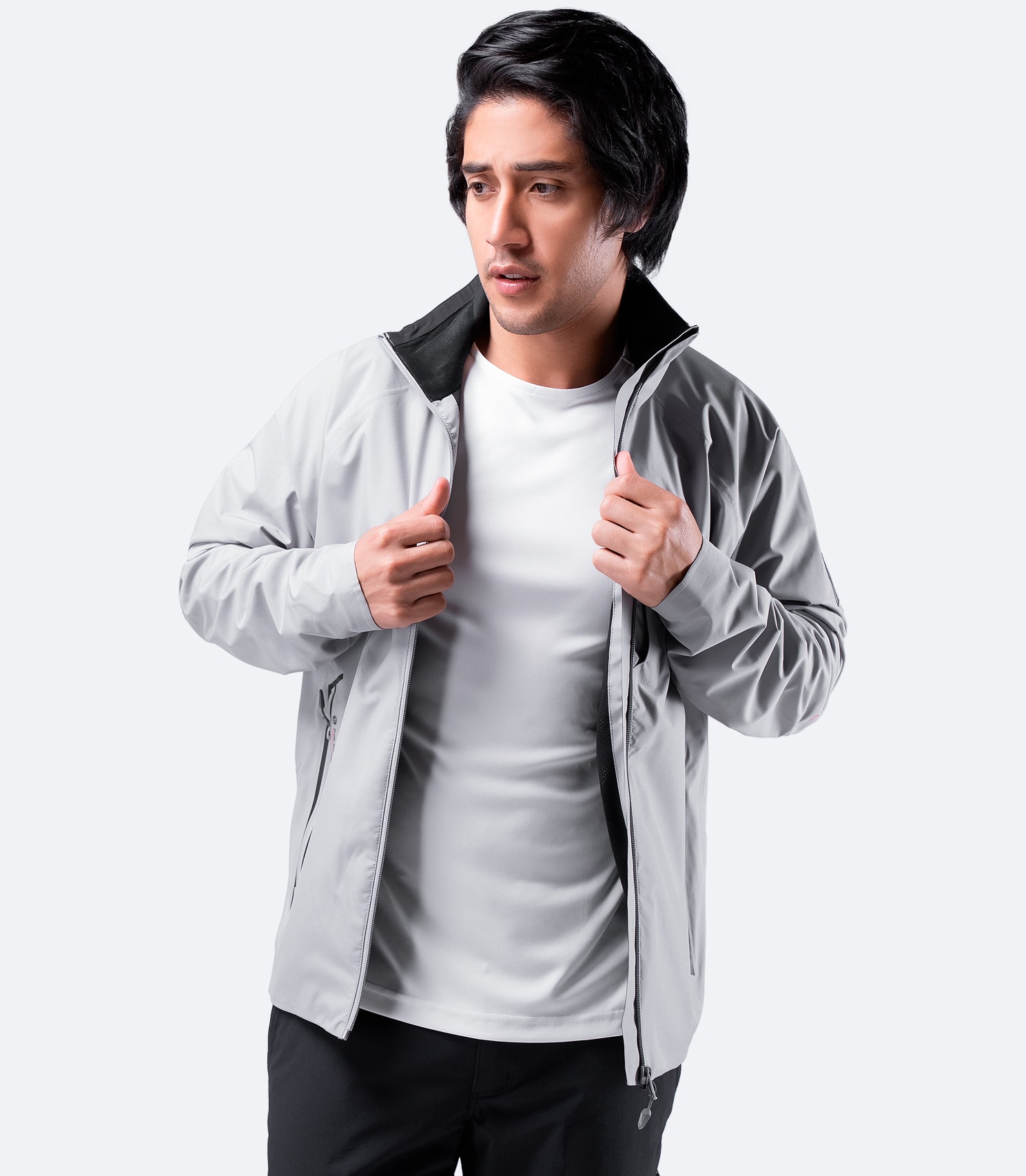 Front view of Zhik Men's INS100™ Jacket in Platinum with open zipper, showcasing lightweight, breathable construction and zippered side pockets.