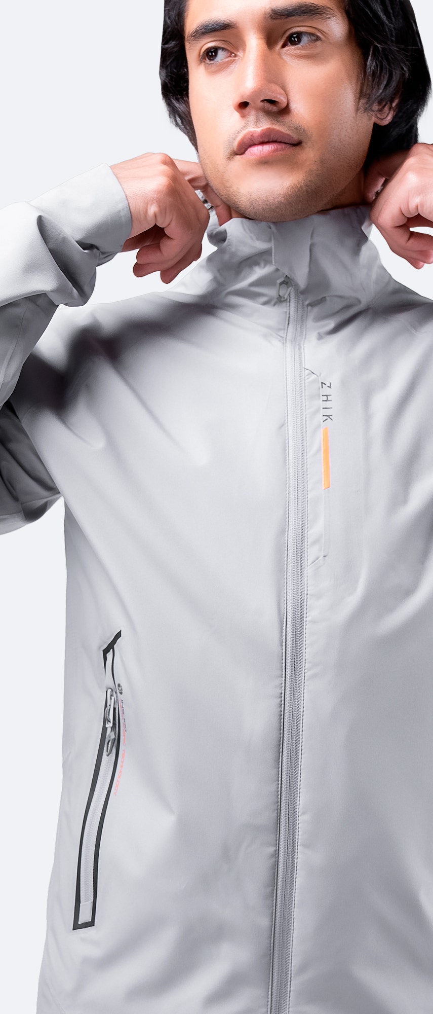 Front view of Zhik Men's INS100™ Jacket in Platinum with closed zipper, showcasing lightweight, breathable construction and zippered side pockets.