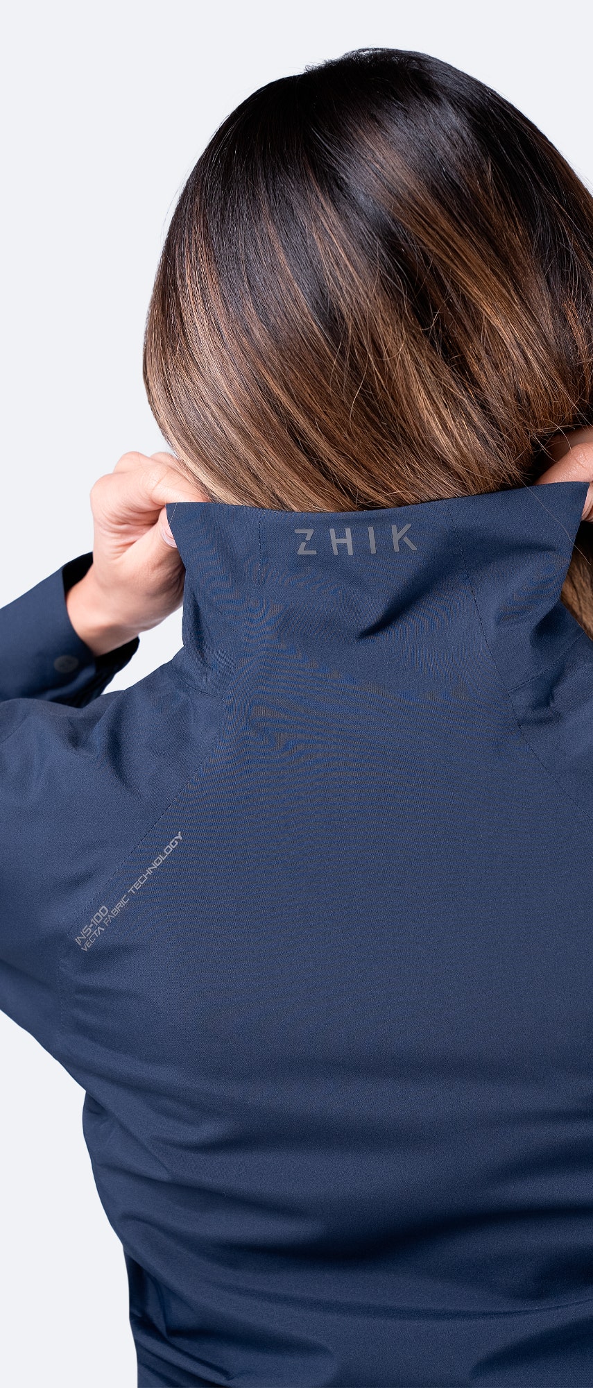 Collar close-up of Zhik Women's Navy INS100™ Jacket, featuring soft inner lining and protective waterproof Vecta fabric.