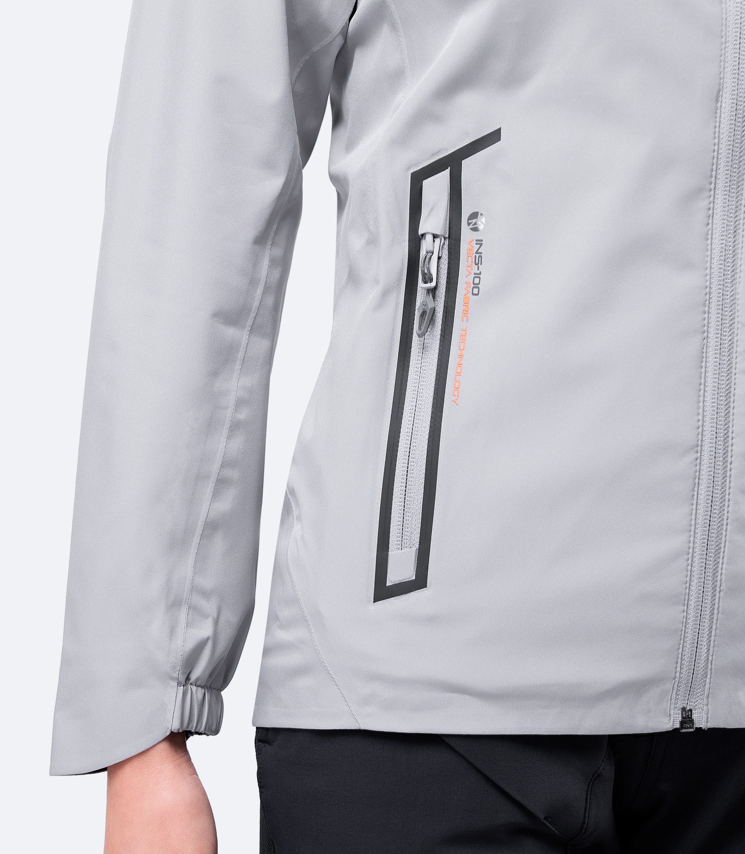 Zippered chest pocket of Women's Platinum INS100™ Jacket in light gray, designed for secure storage with a low-profile look