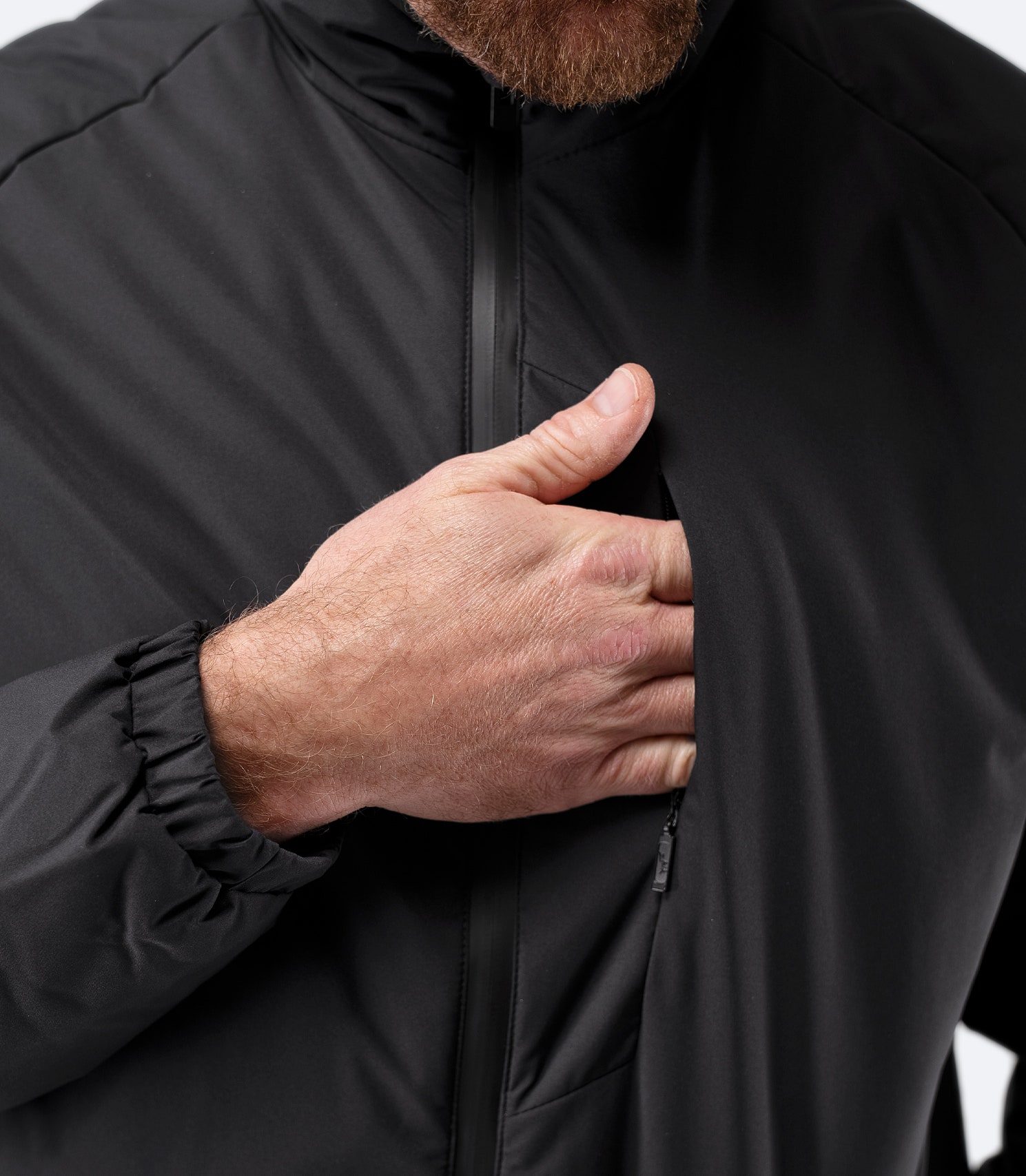 Close-up of chest zipper and collar detail on Zhik Men’s Daybreaker Mid-layer Jacket in black