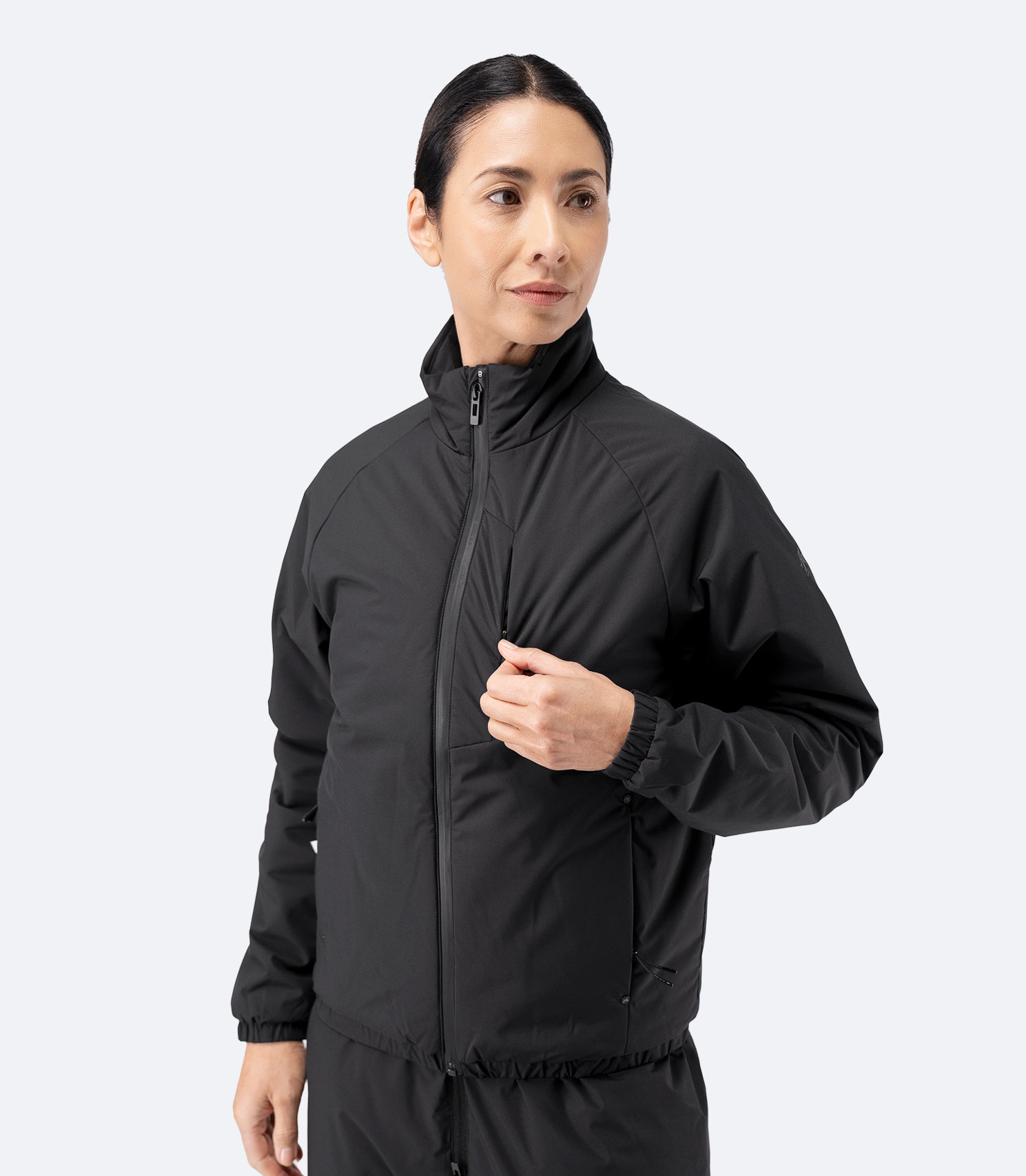 Three-quarter front view of Zhik Women’s Daybreaker Mid-layer Jacket in black, zipped up