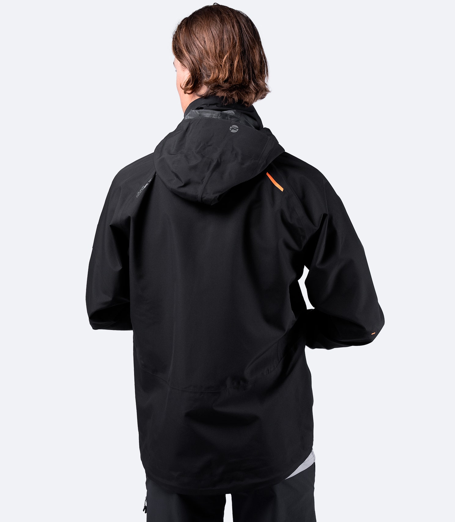 Back view of the Zhik Men's Black INS200 Jacket displaying a sculpted minimalist fit for enhanced comfort and waterproofness