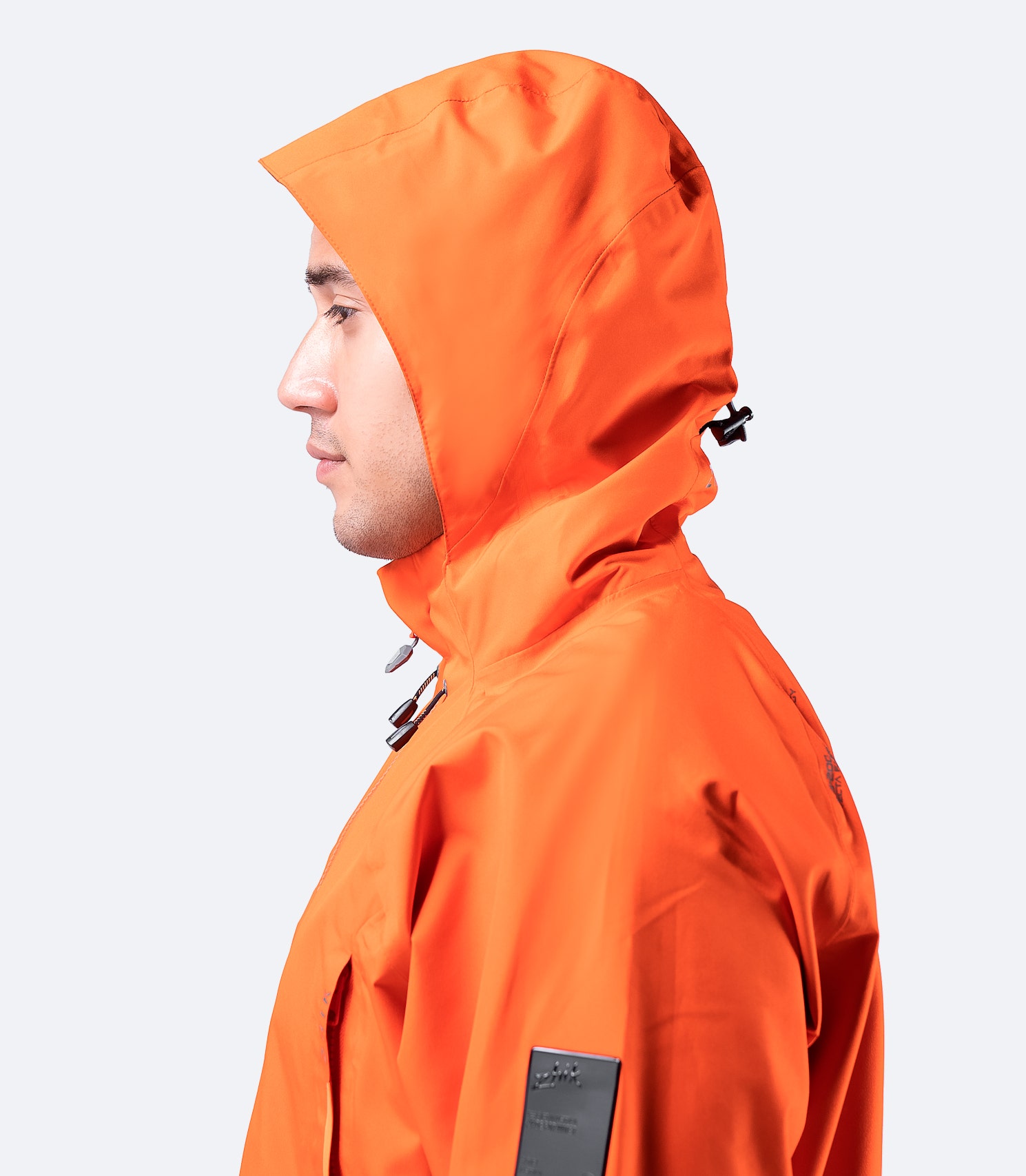 Close-up side view of the hood on Zhik Men's Flame Red INS200 Jacket, showcasing the high collar and adjustable waterproof hood design