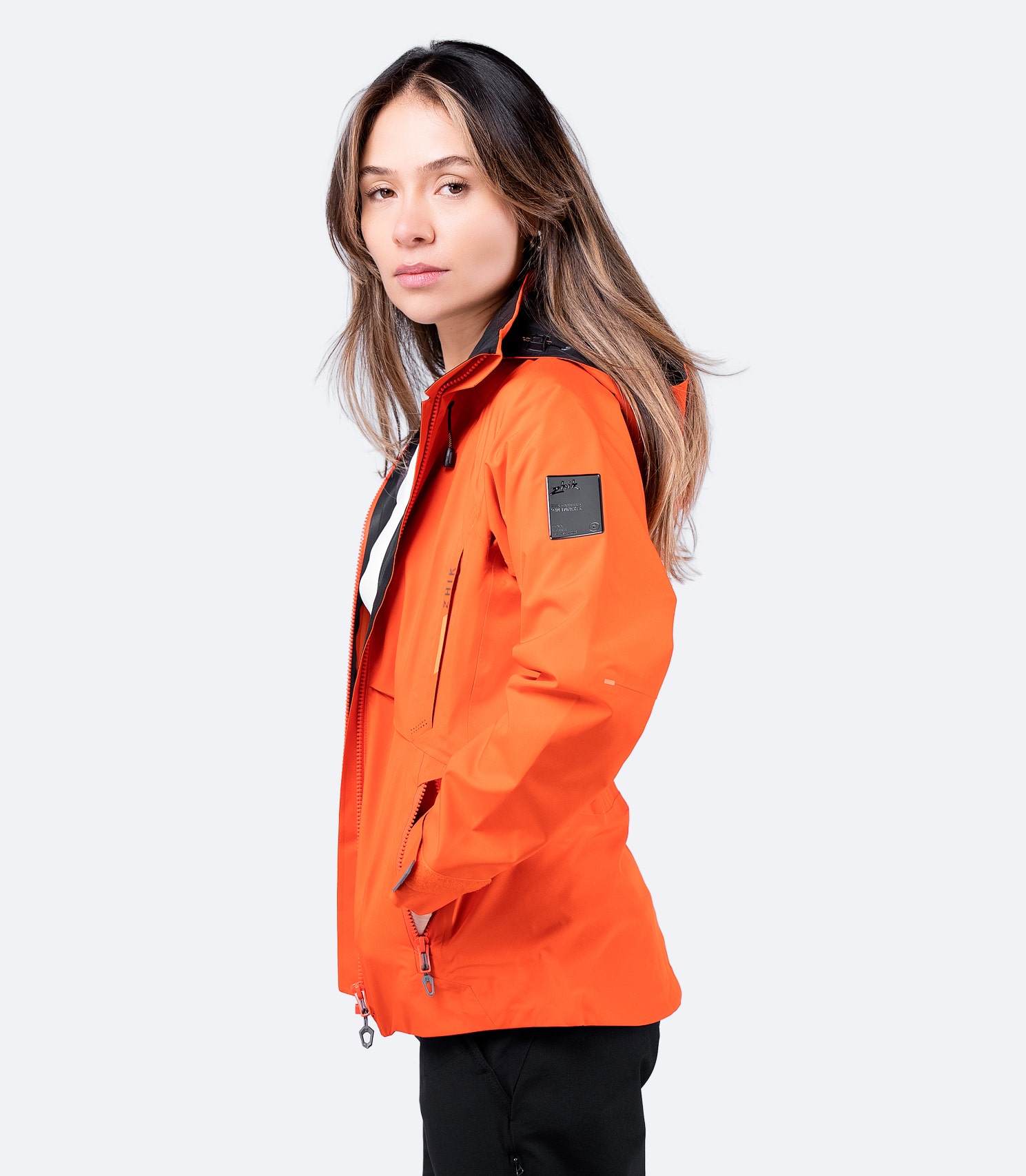 Side profile of the INS200 Jacket highlighting adjustable cuffs with PU lining to prevent water ingress