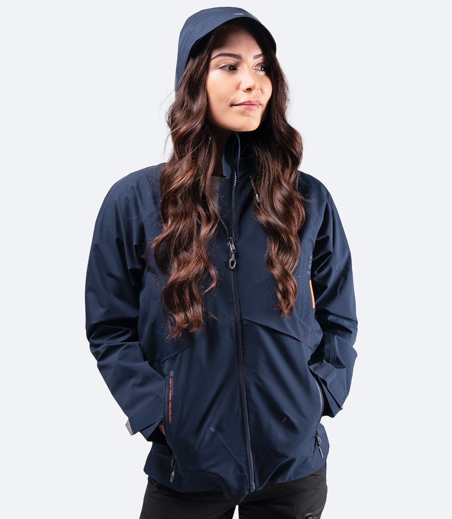 Front view of Zhik Women's Midnight Blue INS200 Jacket with hood up and zip fully closed, providing full waterproof protection