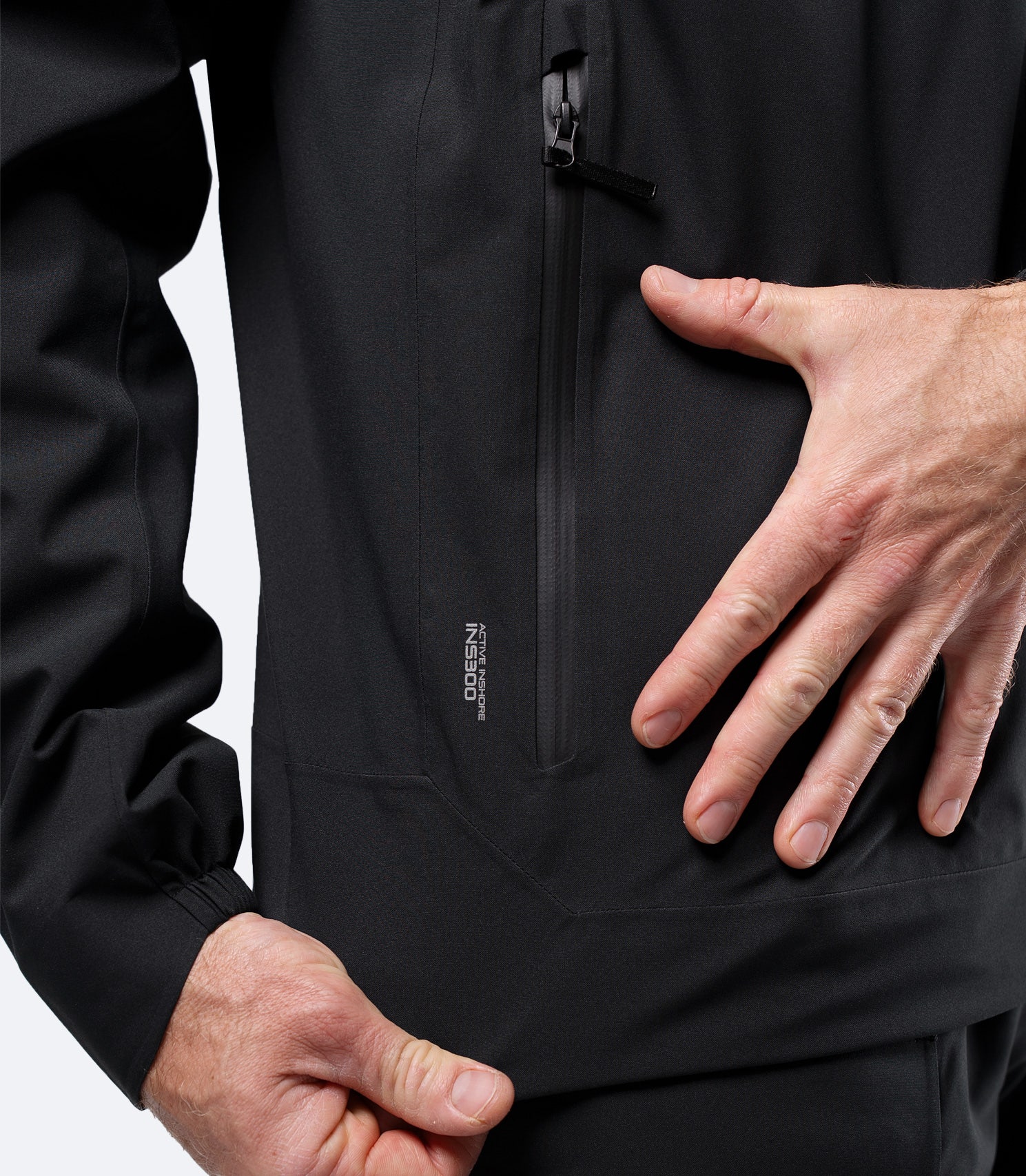 Close-up of front zip pocket on Zhik Men's Black INS300 Jacket, showing water-repellent finish