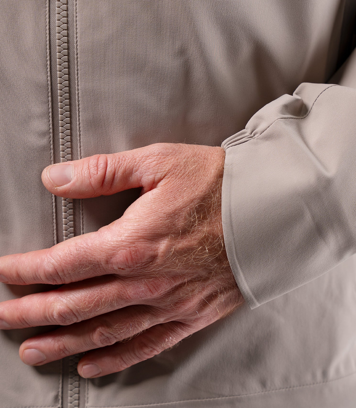 Close-up of sleeve on Zhik Men's Stone INS300 Jacket, with adjustable wrist tab for spray protection