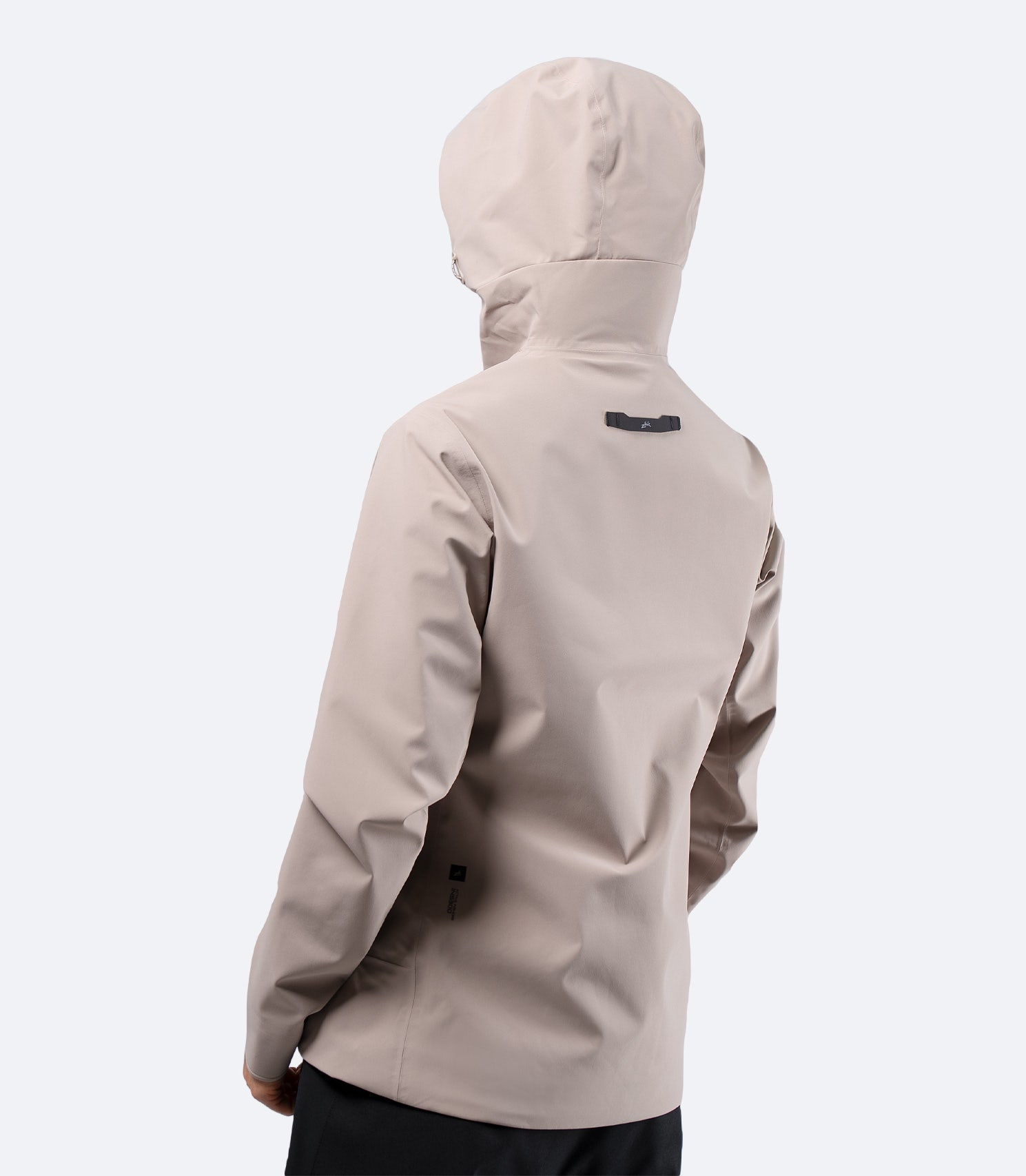 Side-rear view of Zhik INS300 Inshore Women's Active Jacket in Stone, hood up, highlighting tailored women’s cut and hem